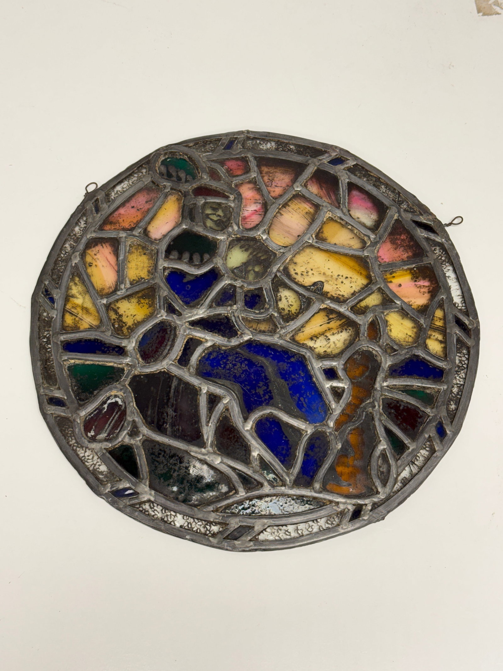 Artisan Stained Glass Roundel Musician Playing Trumpet for Rabbit.: From an upstate, NY collection. Artisan stained glass roundel panel with a musician playing a trumpet for a rabbit. Measures approx 14.5" in diameter. Please see photos for details.