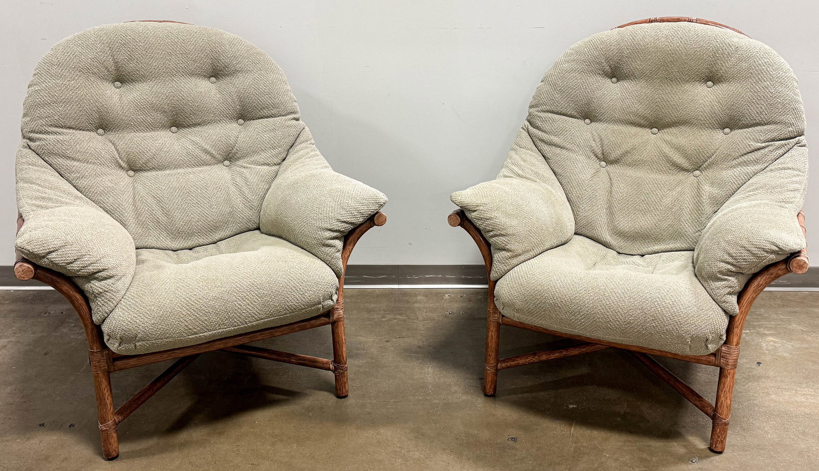 2 McGuire Furniture Co Oversized Lounge Chairs : Pair of vintage McGuire & Co Furniture oversized club/lounge bamboo rattan chairs with sage green upholstered seat cushions. Marked on tag under seat cushion.
