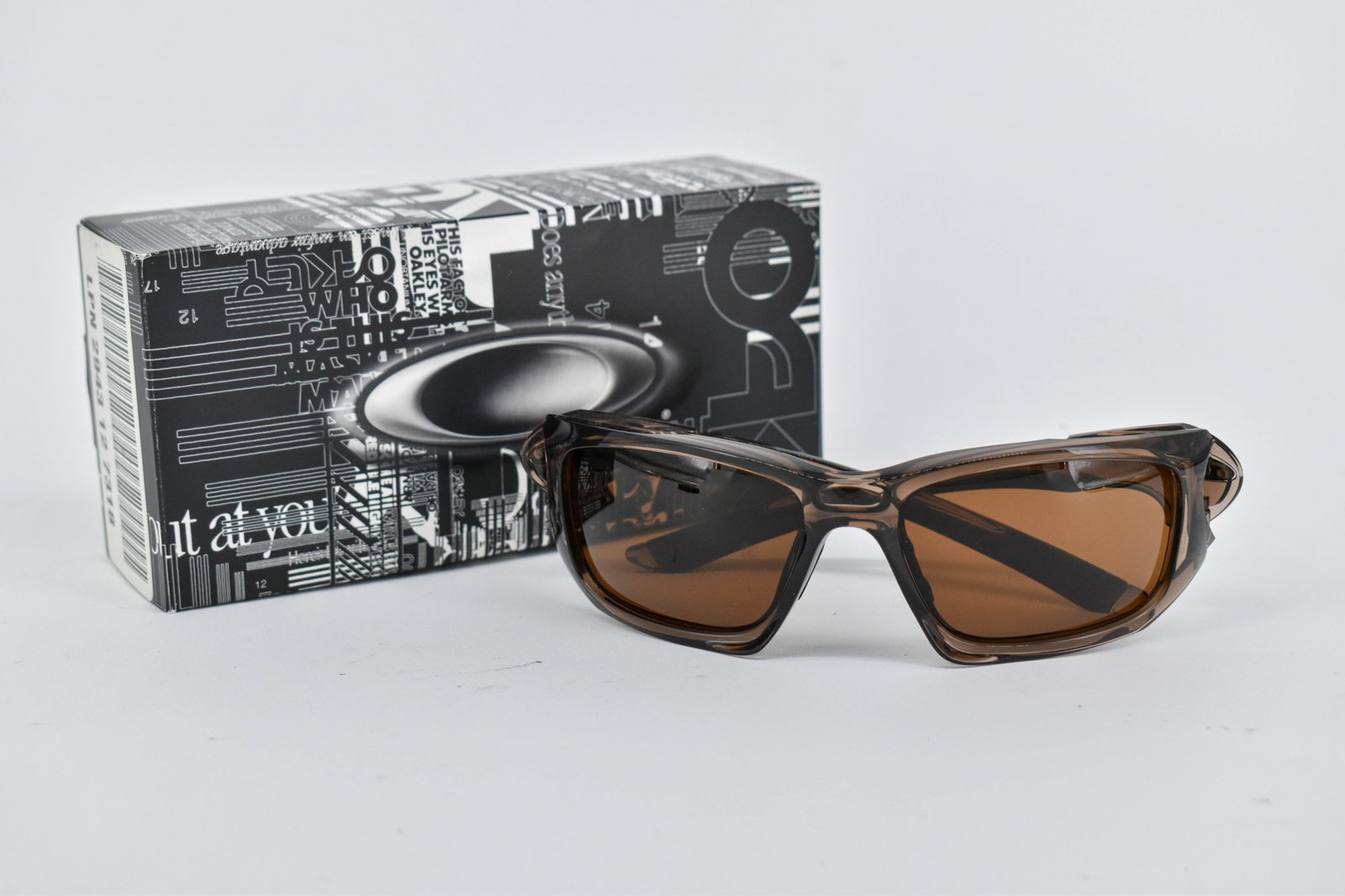 Oakley Scalpel Sunglasses, Brown Smoke/Dark Bronze: Oakley Scalpel sunglasses, with brown smoke frame and dark bronze lenses. Model 009095-02 58 17. In original box. Comes with soft case.