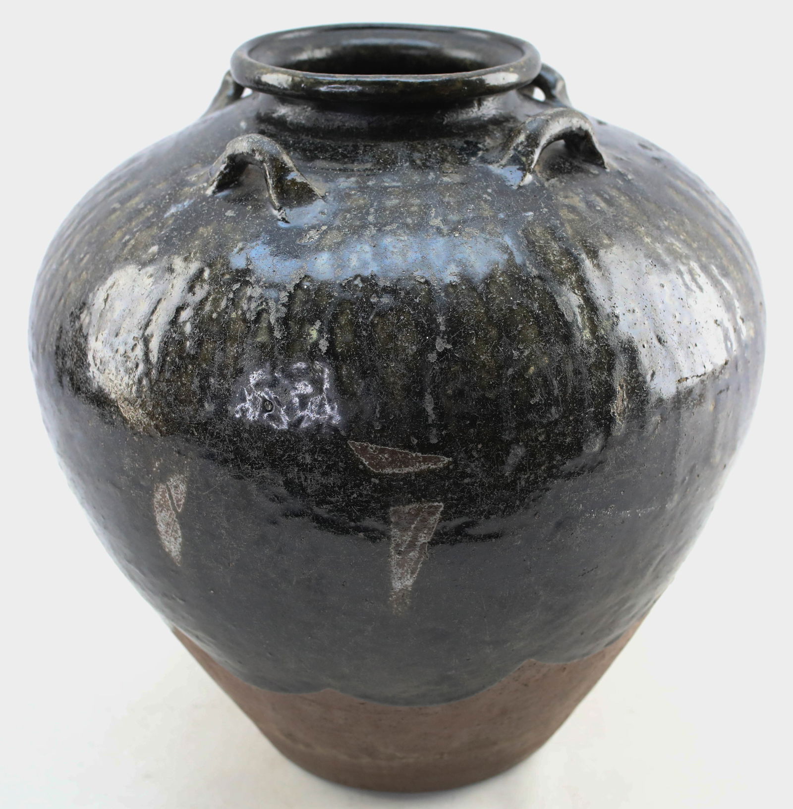 Antique Southeast Asian Martaban Spice Jar 4: Antique clay Martaban glazed ceramic spice jar from Southeast Asia. These vessels are typically from Myanmar (Burma), though similar vessels exist in other countries in the region. Antique, likely 16t
