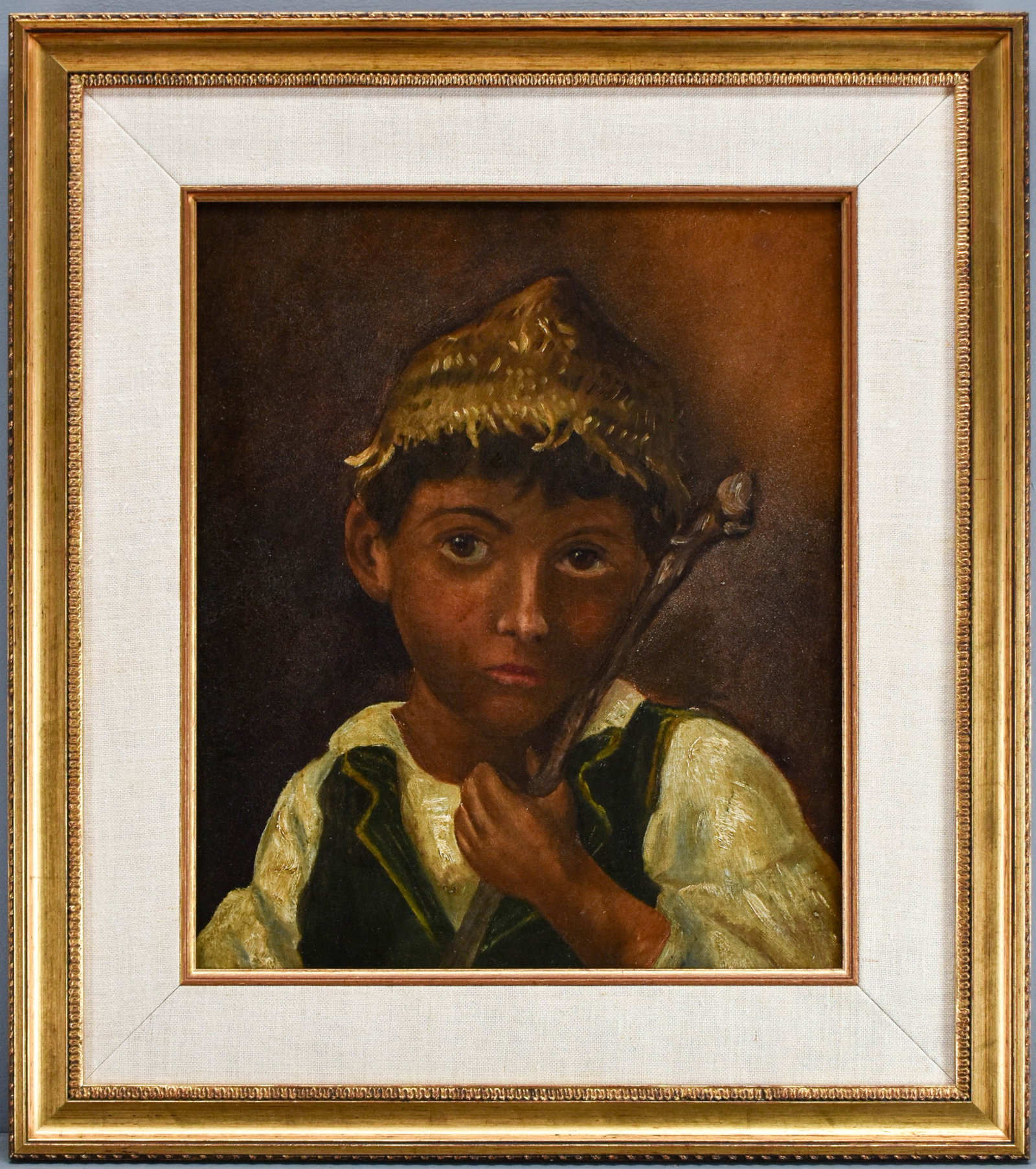 Framed Oil Painting of a Child: Antique portrait of a young boy with a stick rendered in delicate strokes. No visible signature, but some illegible marks on the verso might contain identification. Marked "Lebanese" on the verso.