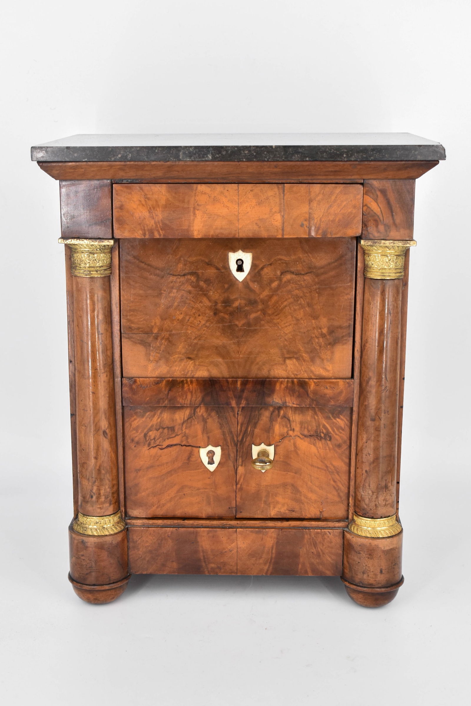 Vintage Salesman's Sample of Empire Desk: Vintage scale model salesman's sample of an empire desk with bone inlay keyholes and brass relief details, as well as a granite top. With lower cabinet, fold down desk surface and shelves, and upper d