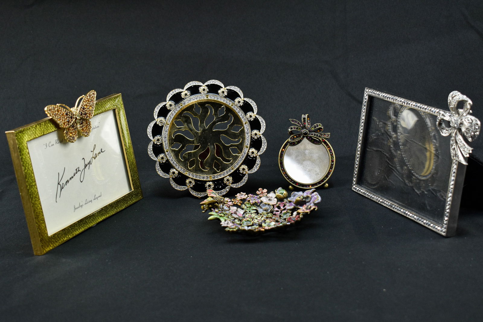 Group of Vintage Kenneth Jay Lane and Jay Strongwater Decorative Items: Includes two picture frames by costume jewelry designer Kenneth Jay Lane (1932-2017), two picture frames by Jay Strongwater, and one reticulated trinket dish by Jay Strongwater that resembles a flower