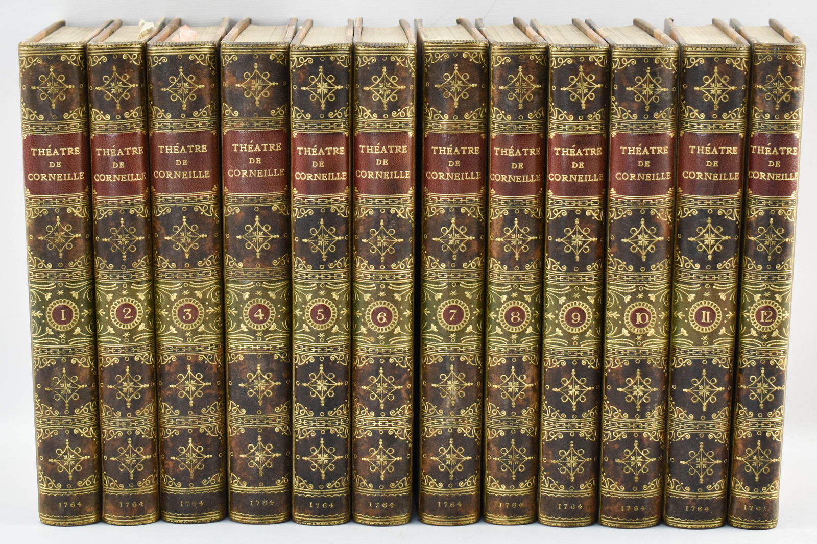 Antique 1764 Theatre de Corneille Set, 12 Volumes: 12-volume set of the collected works of 17th-century playwright Pierre Corneille in the original French. Full title is Theatre de Pierre Corneille, Avec Des Commentaires. Dated 1764. The covers featur