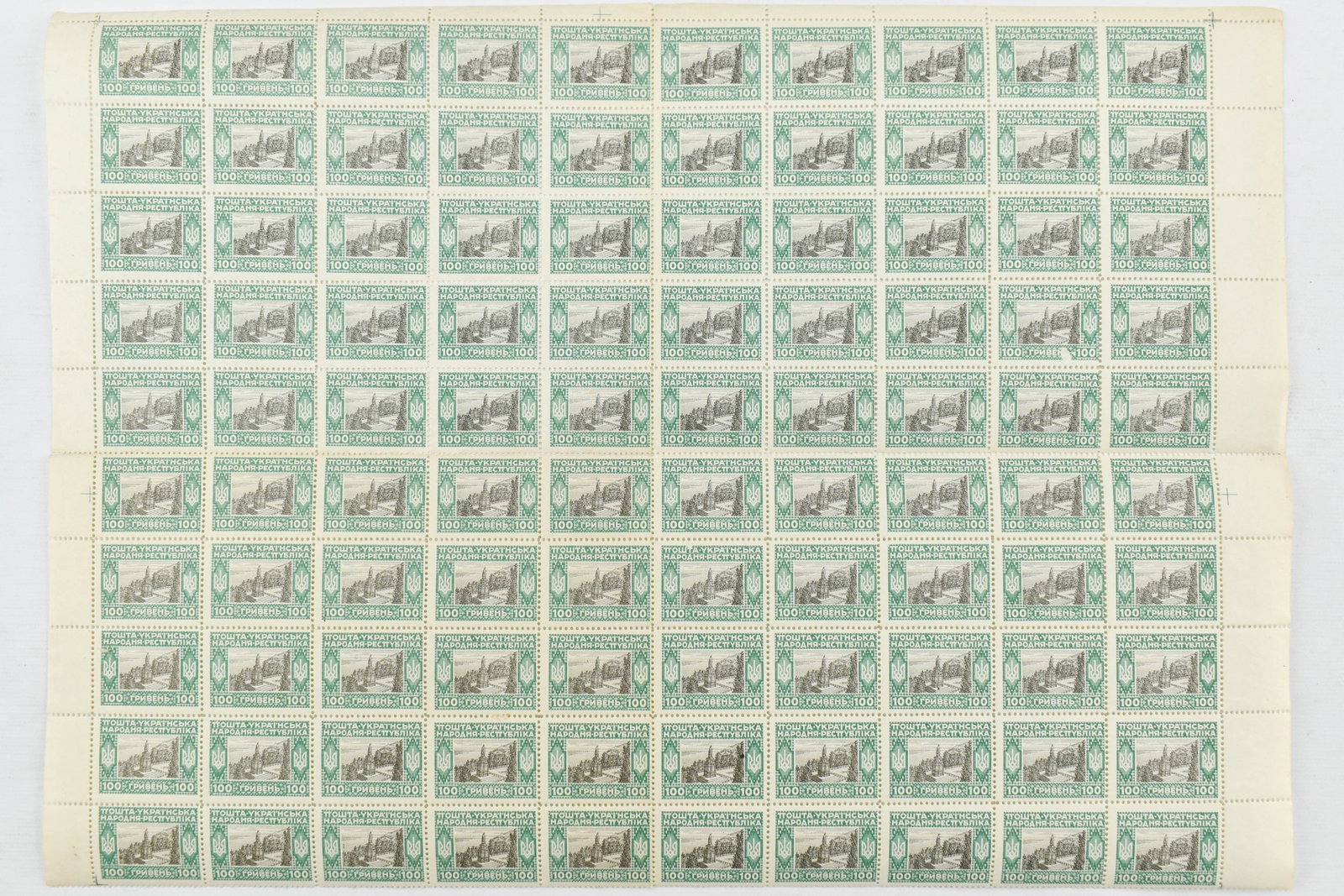 1920 Ukraine 100G Green & Black Stamp Sheet: Lot includes a sheet of 10 stamps by 10 stamps. Sheet has been folded/hinged into quarters as pictured. All stamps sold as is.