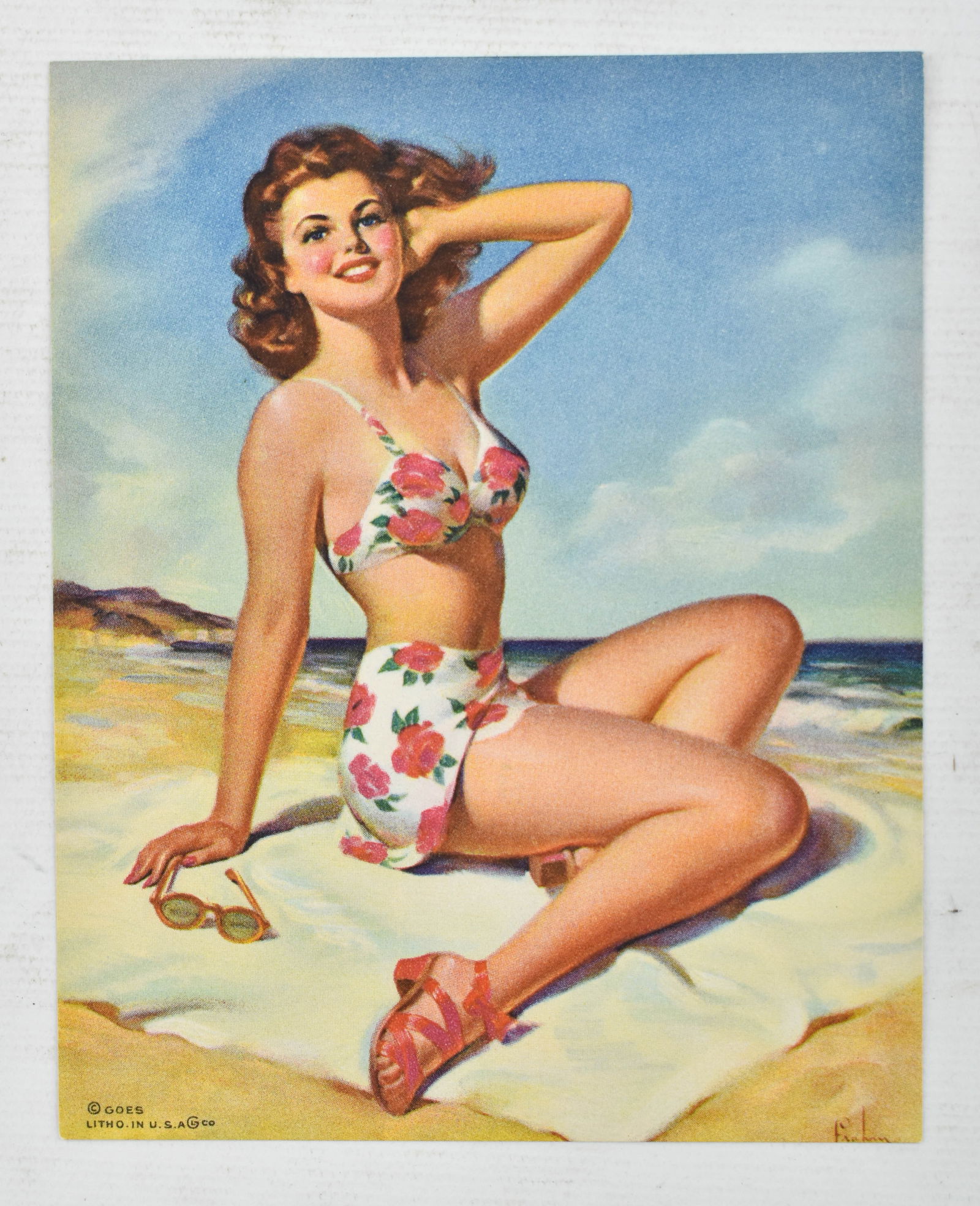 Vintage Pin-Up Girl Lithograph by Art Frahm: Vintage 5 x 4 lithograph of a pin-up girl posing on a beach by American commercial artist Art Frahm. Copyright in the lower left corner. Stamped GP-10250 on the verso.