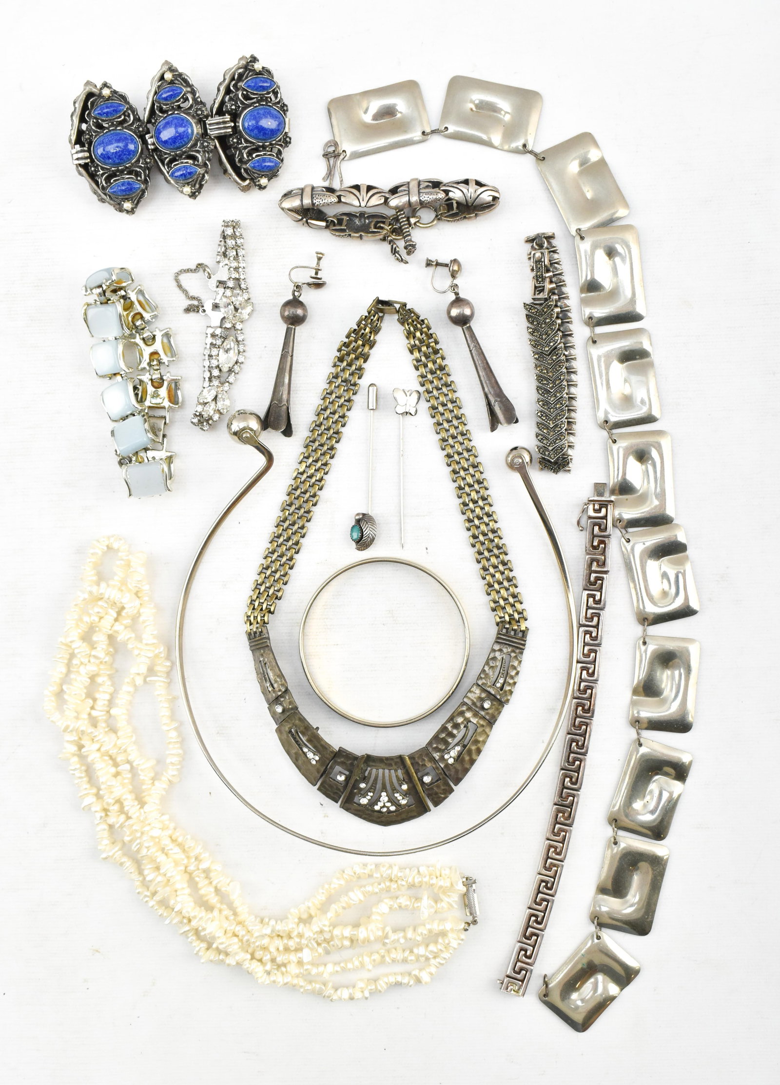 Group of Vintage Silver-Tone Costume Necklaces and Bracelets: Group of vintage costume jewelry including necklaces, bracelets, and earrings. Several feature stone inlays. Dimensions describe the earrings.