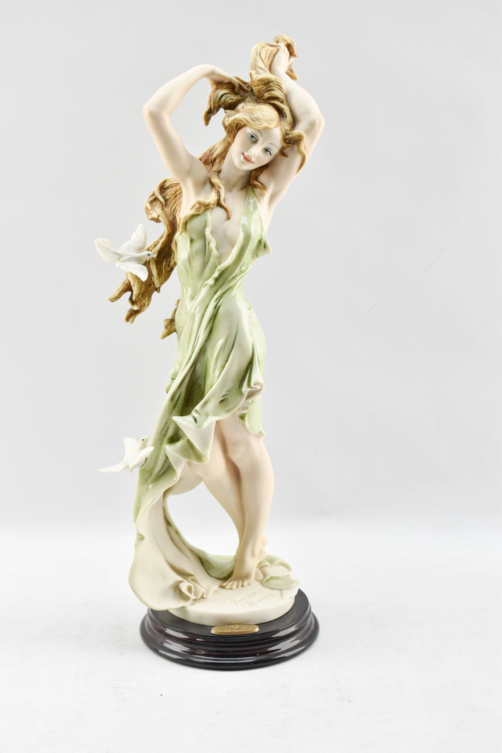 Giuseppe Armani Limited Edition 'Aurora' Sculpture: Porcelain statuette titled 'Aurora' depicting a maiden playing with her hair while doves flit around her by Italian sculptor Giuseppe Armani. Hand-numbered 6291/7500 as part of a limited-edition run.