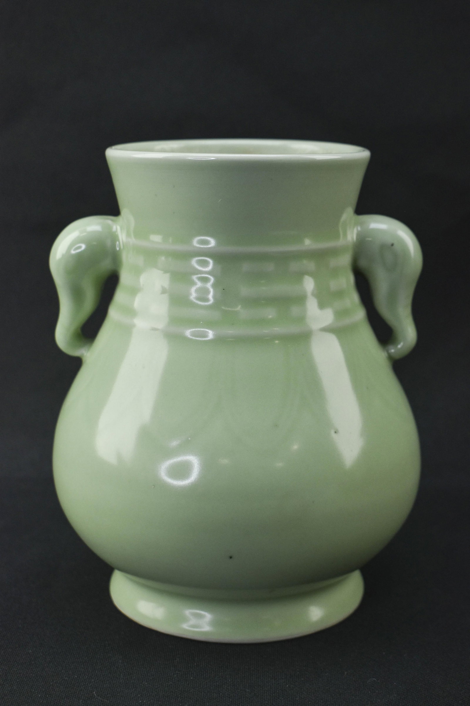 Chinese Celadon Vase: 6 x 4.75 x 4.75. Chinese celadon vase with handles in the form of elephant heads. Marked on underside. 6H x 4.75W x 4.75L