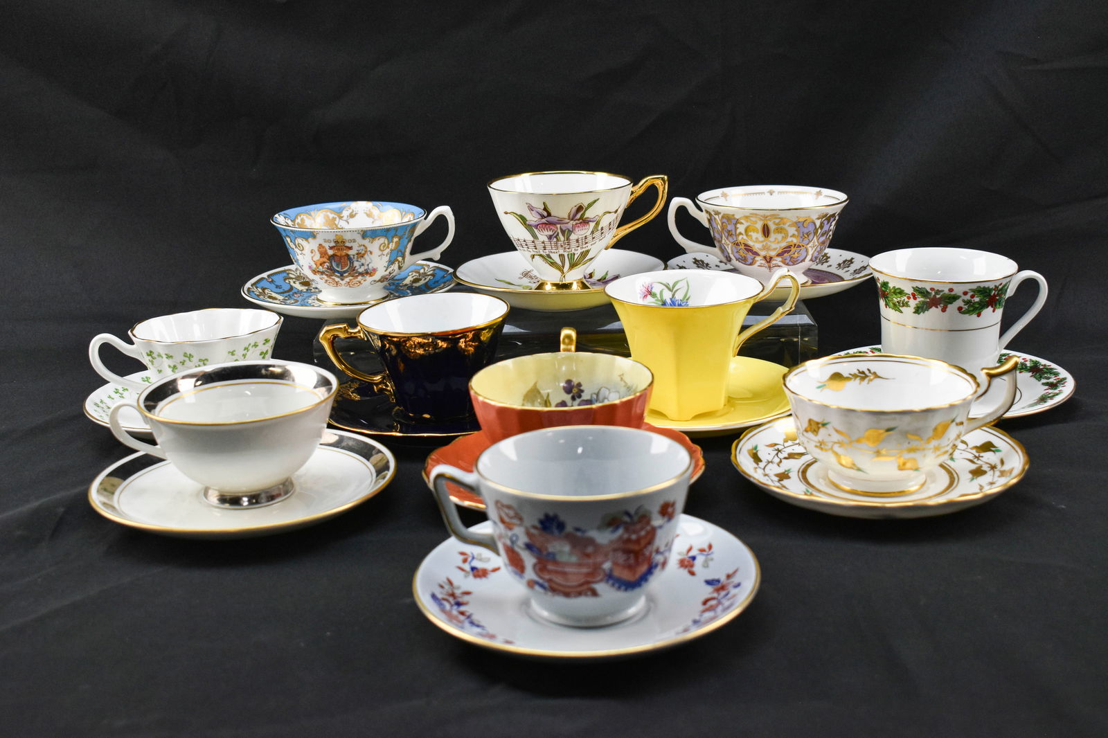 Vintage China Teacups and Saucers - Royal Collection, Spode, Imperia Limoges, and More: Eleven china or porcelain teacups with matching saucers including a 2002 Royal Jubilee Royal Collection set, a Holyroodhouse Palace Royal Collection set, a Royal Ardalt Minnesota state moccasin flower