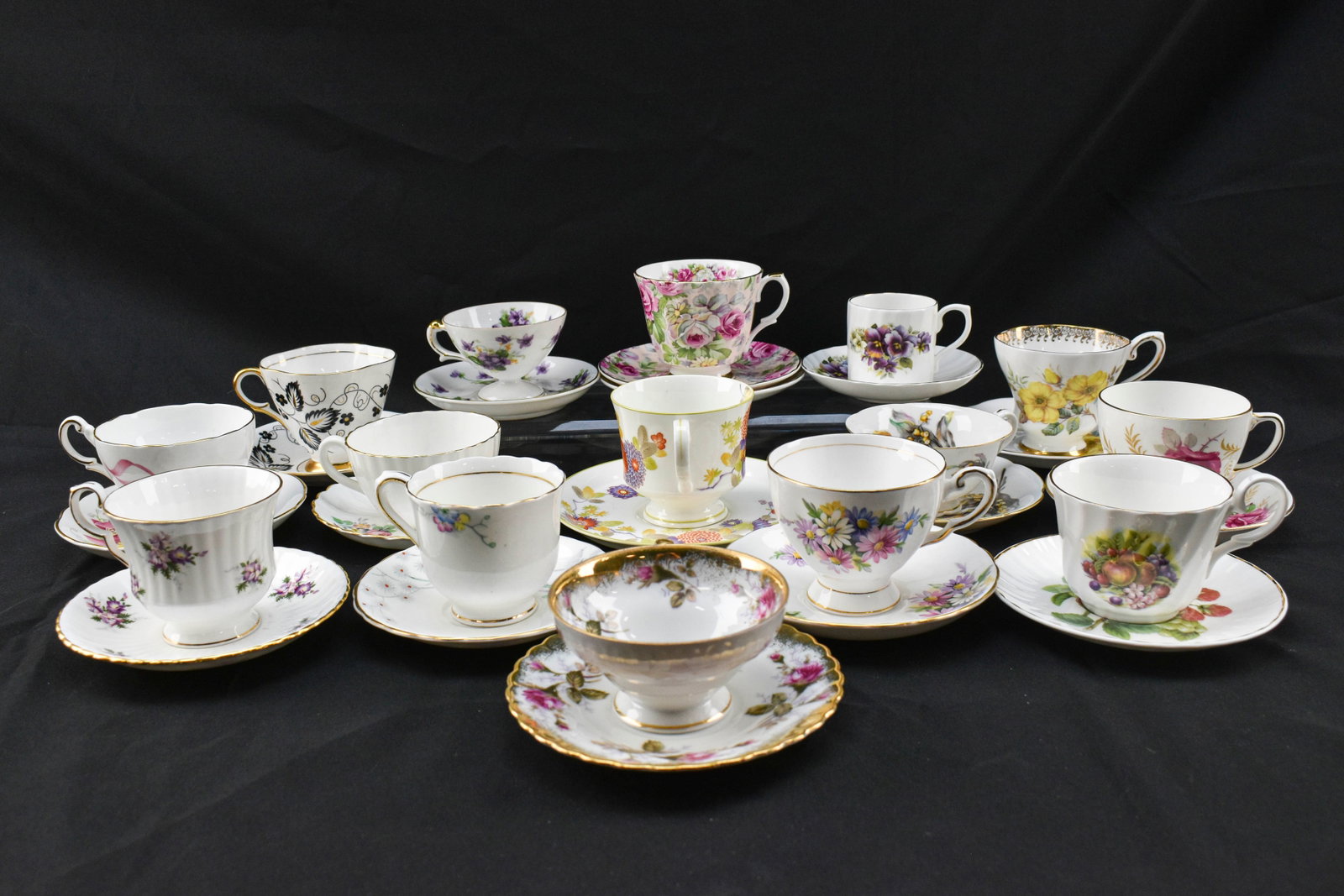 Vintage China Teacups and Saucers - Allyn Nelson, Royal Windsor, and Victoria C&E: 15 china teacups with matching saucers including two Allyn Nelson sets with one extra rose saucer, a Royal Windsor set, a Radford's set, a Tuscan Bone China set, a Regency 'Bridesmaid' set, a Mikasa '