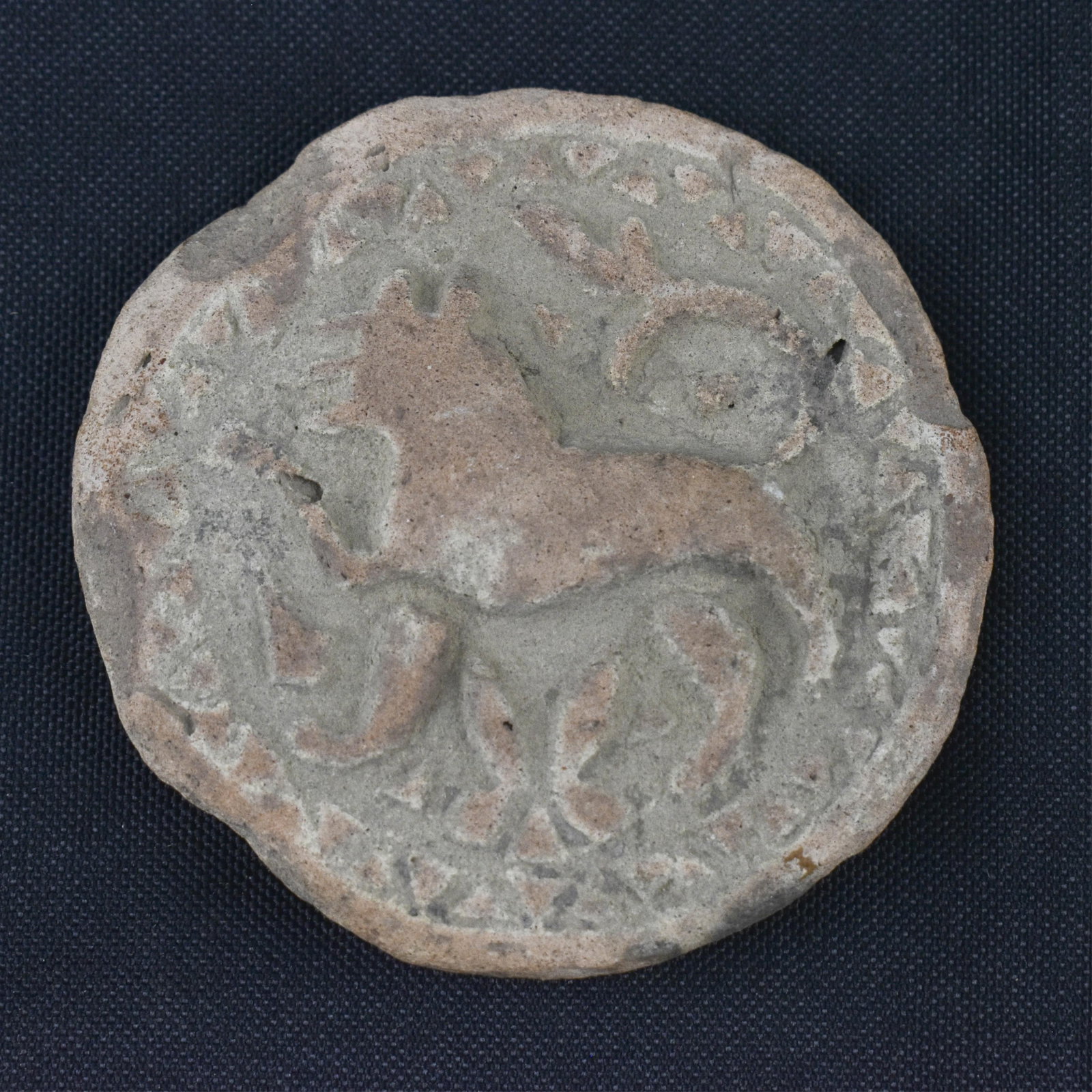 Antique Persian Seal Impression: 2.75 Dia. Antique Persian seal impression in ceramic depicting an animal, perhaps a lion. 2.75 x 2.75 x 0.25