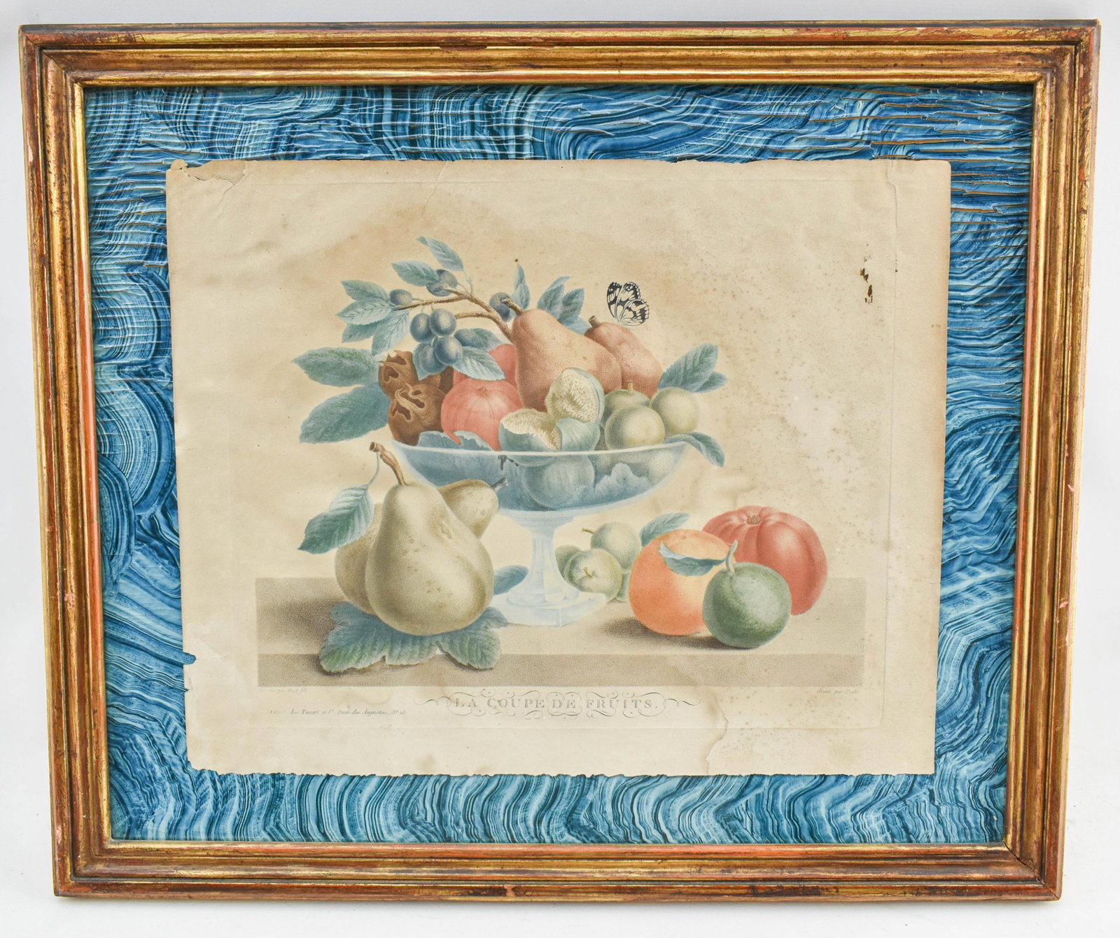 Antique "La Coupe de Fruits" Print by Tessari: Framed still life with fruit and a butterfly printed on paper by Tessari in France circa 1818. Designed by Huet Fils. Possibly a stipple engraving. The frame backing features a blue and gold tone reli