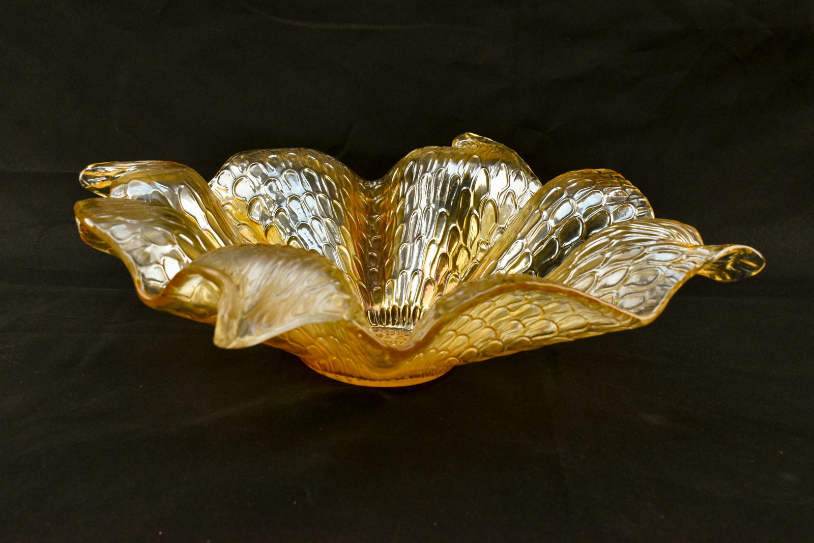 Murano Iridescent 15" Glass Centerpiece Bowl: Murano art glass bowl made in Italy with gorgeous wave design with ruffled edges and four curled ends. With a raised geometric pattern throughout. Gold/pink iridescent finish. 4 1/2"H x 15"W