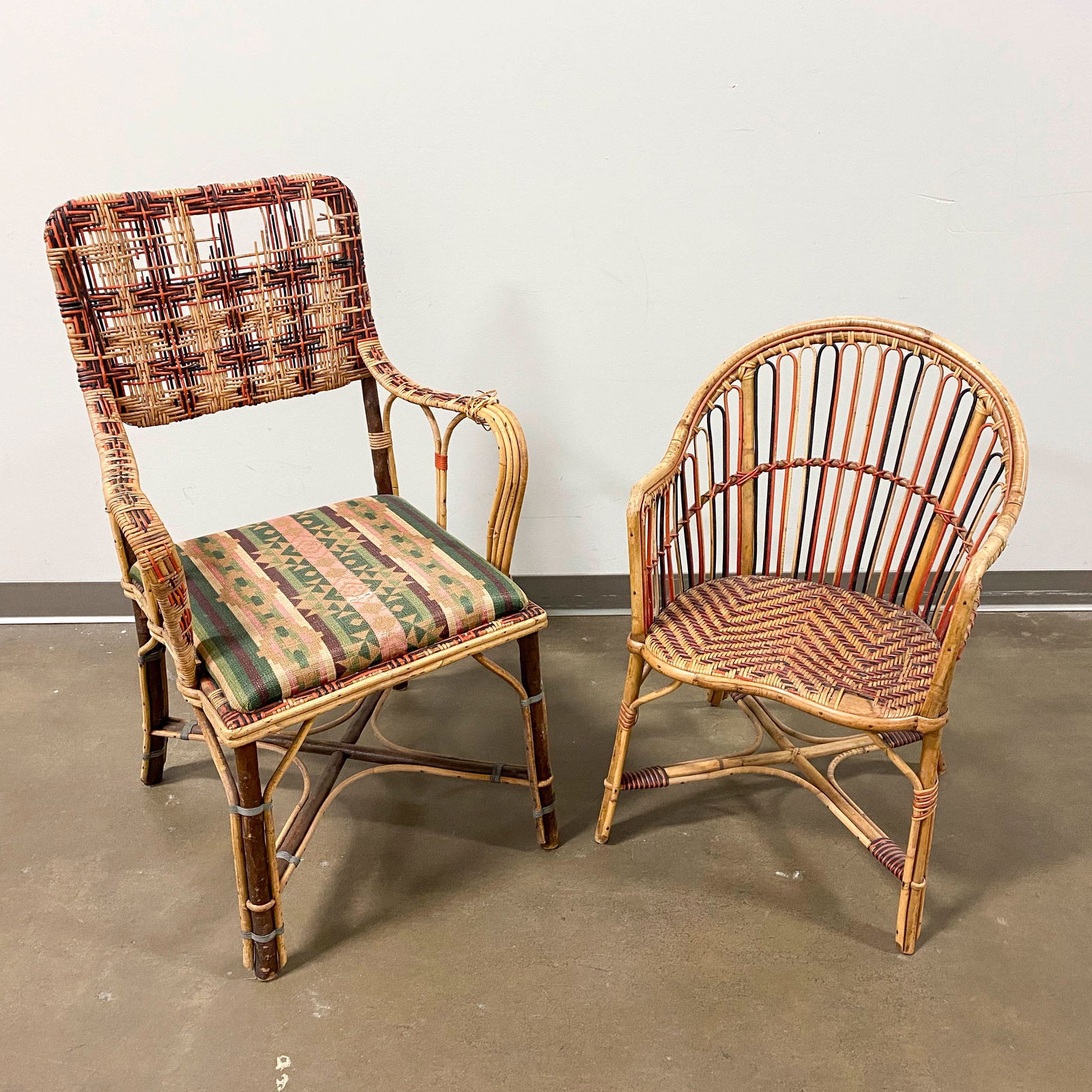 Two Vintage Woven Cane Chairs by Perret & Vibert, Damaged: Two vintage woven rattan cane chairs from Perret & Vibert including one larger armchair with a green fabric seat and one smaller armchair with a curved back. Each marked on back side. Each have signif