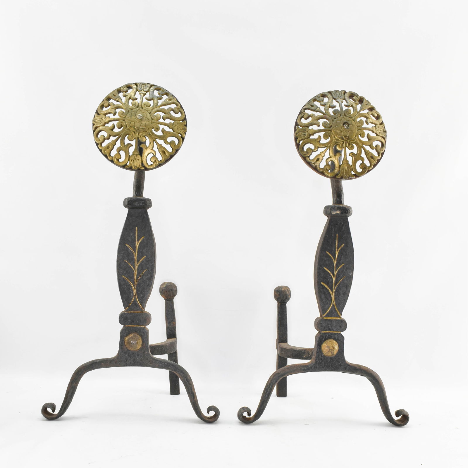 Pair Vintage Virginia Metalcrafters Andirons: Pair of iron andirons with floral decoration throughout. Andirons have been cut off at the back end to shorten their depth.23.25"H x 12.25"W x 8"D.