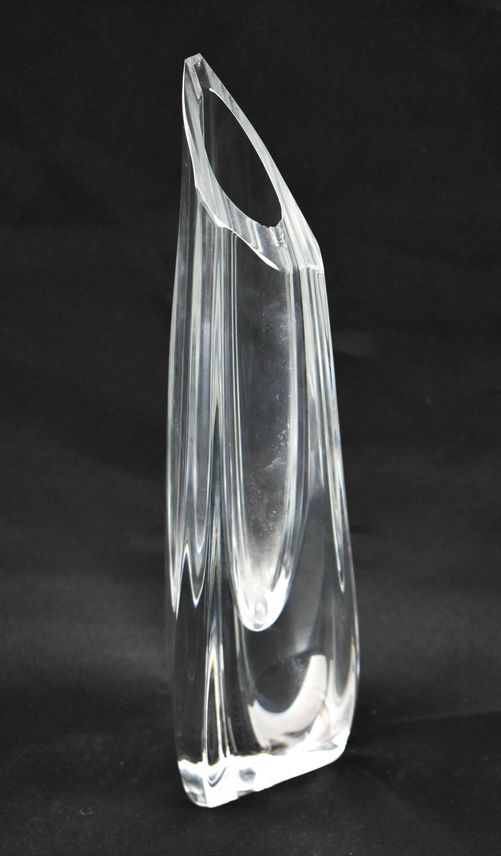 Baccarat Crystal Rose Bud Vase: Tall clear crystal bud vase from Baccarat in the pattern Rose. Triangular vase with slanted opening. Marked on underside. 12.75 x 3.5 x 3.5