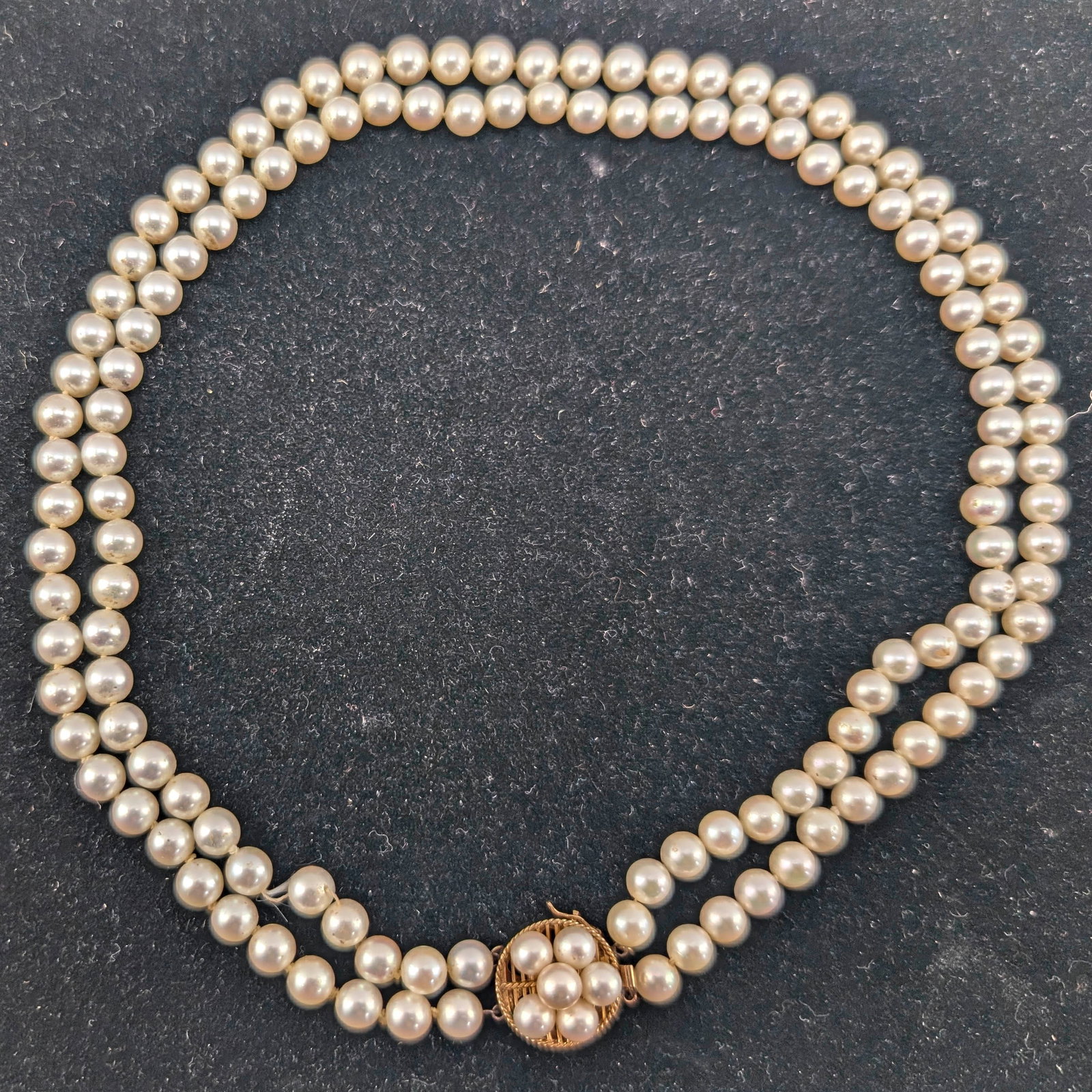 2 String Pearl Necklace: 18" Pearl choker style necklace with two strands and a cluster of pearls on a central setting. Setting is marked K14.