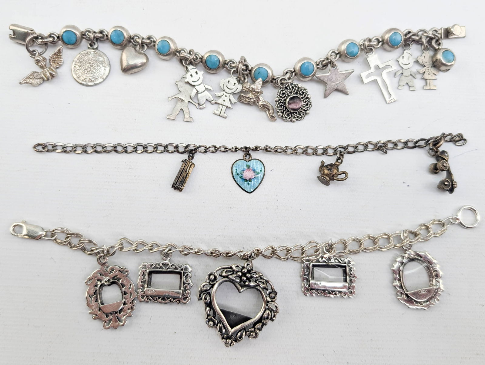 3 Charm Bracelets, Sterling Silver: 3 charm bracelets ranging from vintage to modern. Most items (charms and chains) are marked 925 or sterling. One bracelet set with turquoise stones.