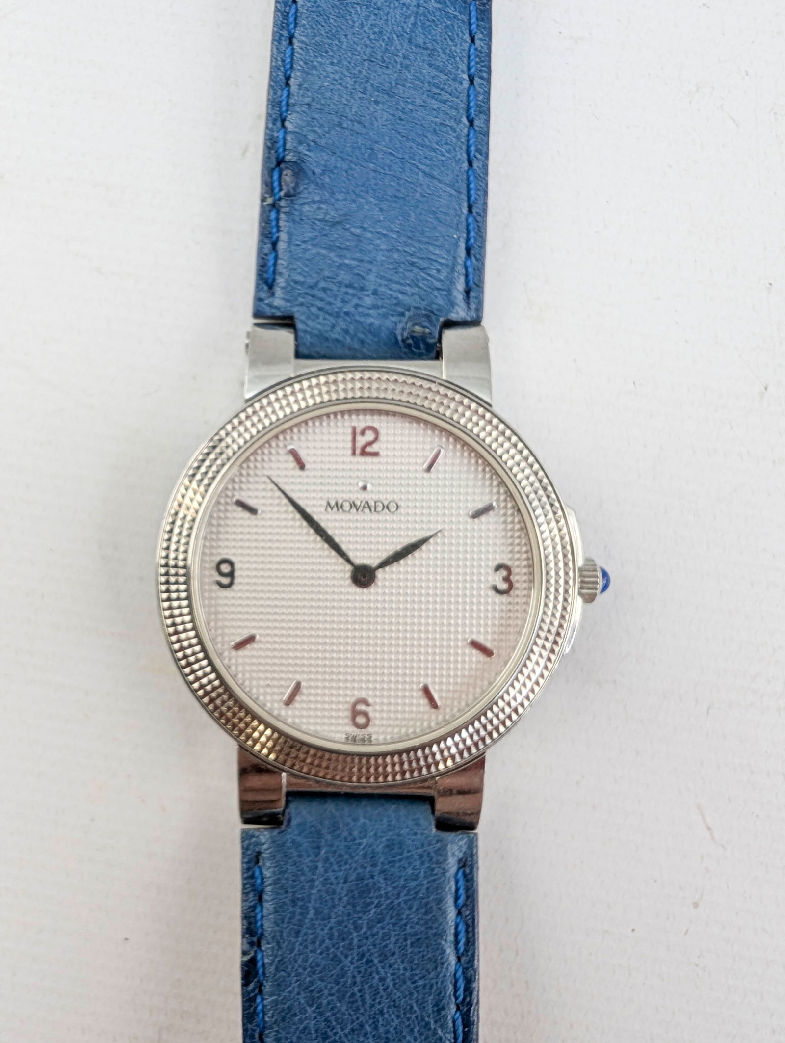 Movado Textured Bezel Watch: Back of case reads 84-A2-891, 374427, Quartz, Water resistant, Sapphire crystal, All steel.