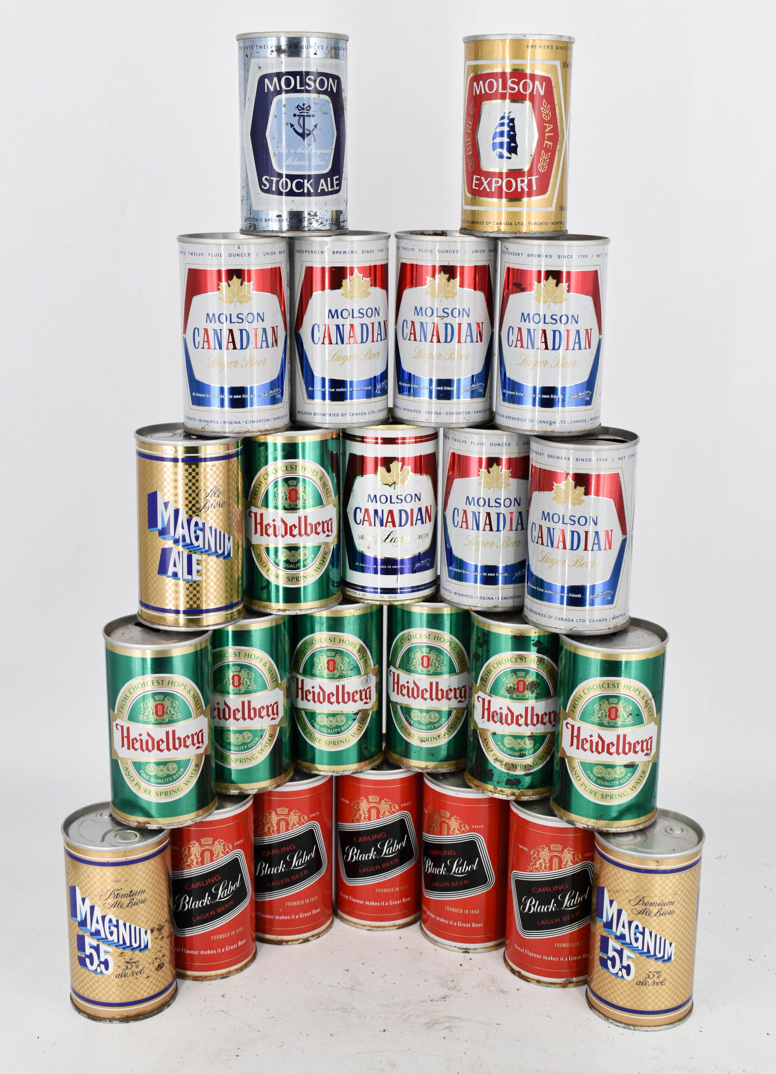 Assortment of 24 Vintage Beer Cans from Brands Including Carling Black Label, Magnum 5.5, Heidelberg: Lot of 24 steel top and bottom opened vintage beer cans. This lot features brands including Carling Black Label, Magnum 5.5, Heidelberg, Molson (Canadian, Stock Ale, and Export). Styles include pull t