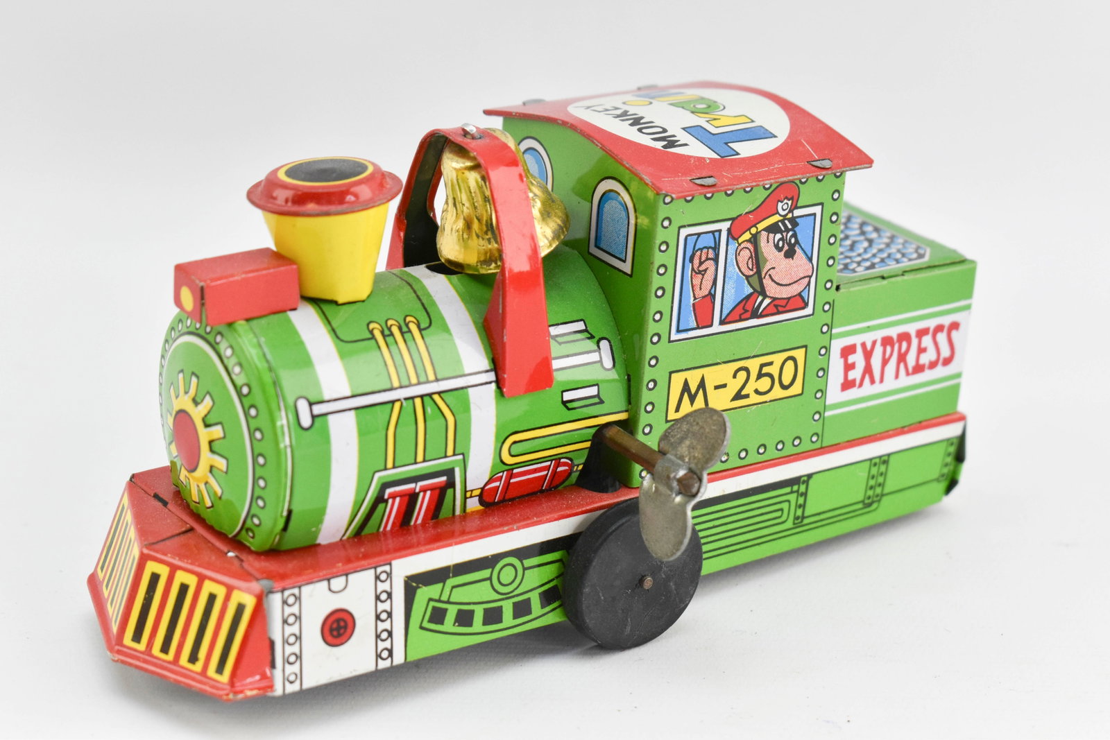 Yone Japanese Monkey Train Wind Up Locomotive: Tin litho wind up toy train locomotive made by Yone. Toy winds up and wheels move. 3H x 3W x 5.5L