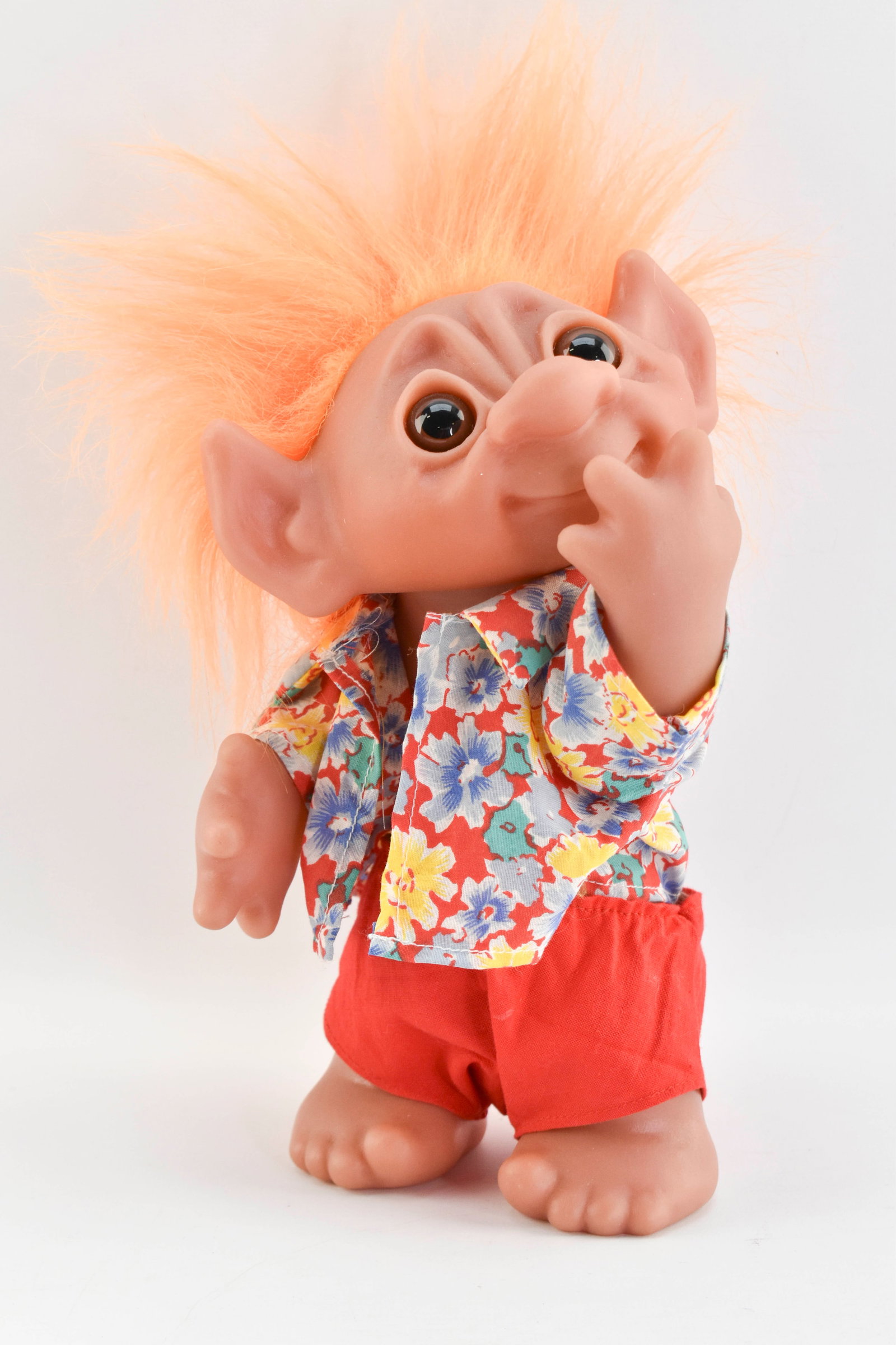 1977 Thomas Dam Troll Doll Made in Denmark: Troll doll with orange hair, flowered shirt, and red shorts. Back is stamped Thomas Dam 1977. 9H x 5W x 4D (not including wild hair!)