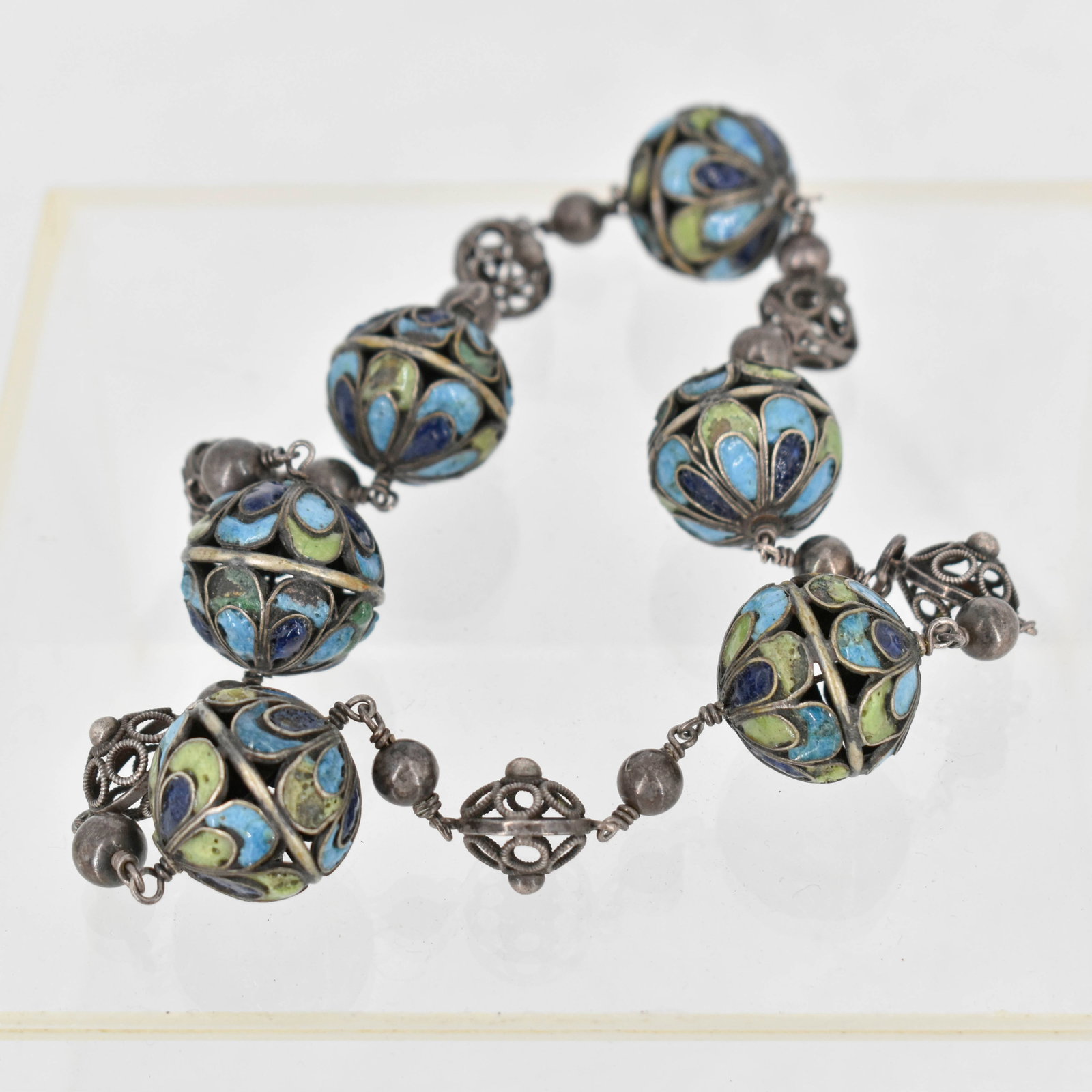 Enameled Silver Necklace: Enamel and silver necklace with pierced enamel orbs in blues and greens, mark not identified. 15"L
