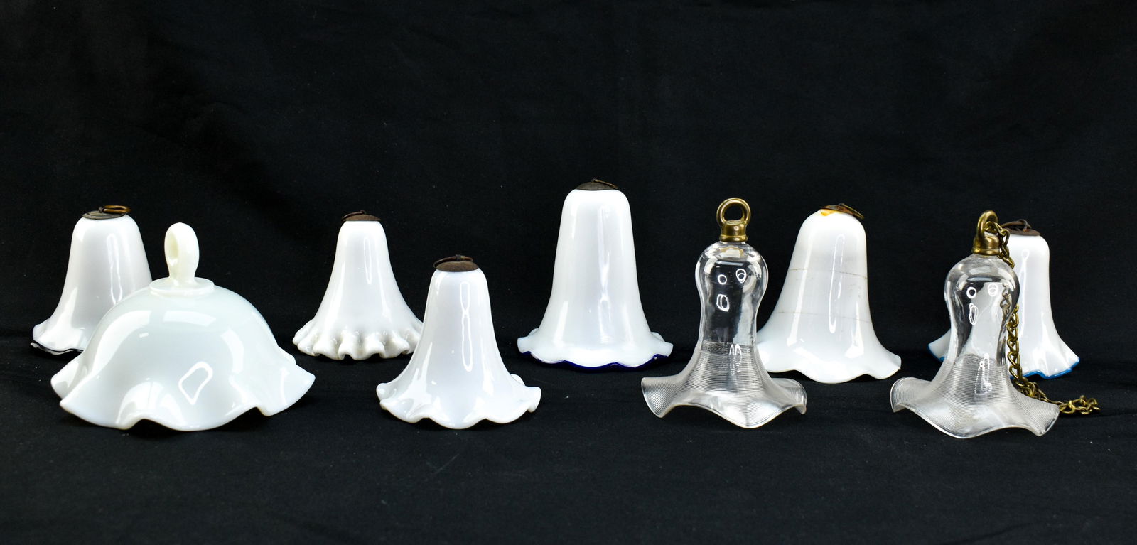 8 Antique Glass Smoke Bells for Parlor Lamps: Includes 9 hanging smoke bells for use with hanging oil lamps. Includes 7 milk glass bells in different shapes and sizes and 2 matching clear glass bells.Heights range from 3" to 4".