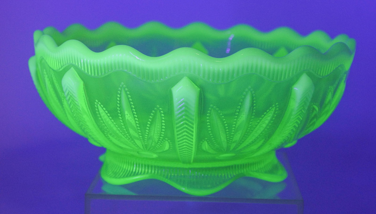 Topaz Opalescent Vaseline Glass Bowl: Footed uranium glass bowl with radish patterning throughout, unmarked. 3 1/2"H x 8"Dia