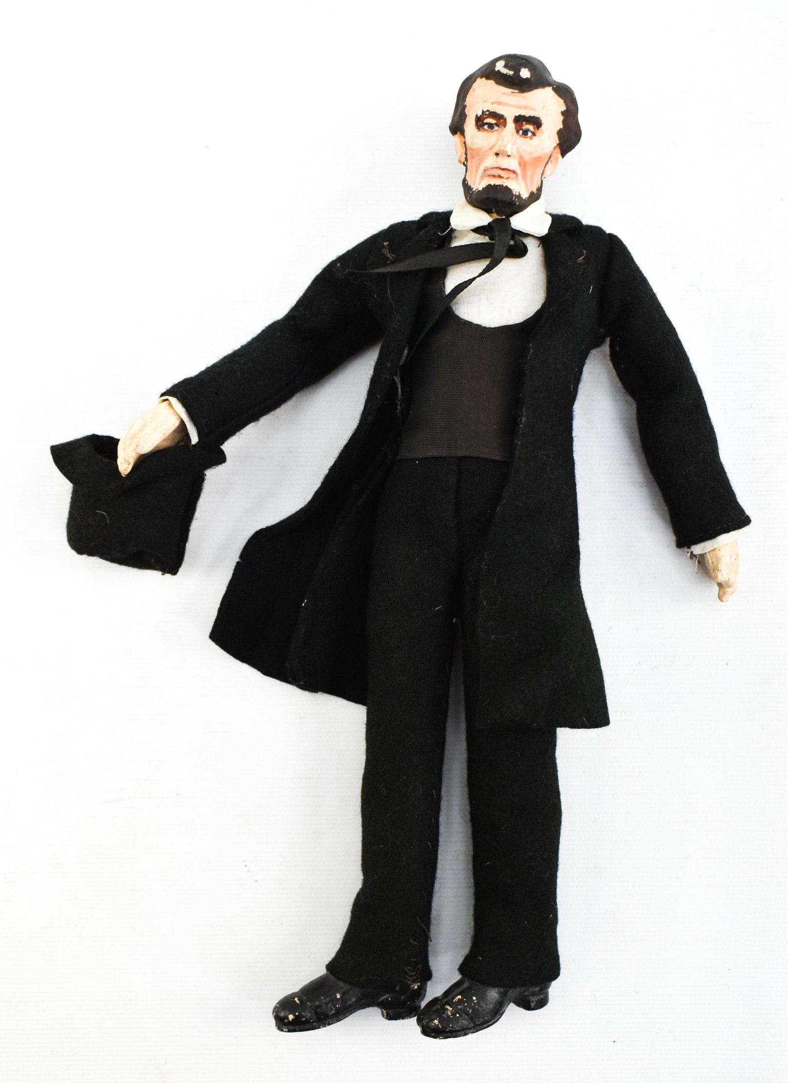 Antique Abraham Lincoln Doll: Vintage Abraham Lincoln doll with plaster (or similar material) molded head, hands and feet and stuffed torso made by Kimport / Kimcraft Dolls of Independence, Missouri. Kimport produced dolls between