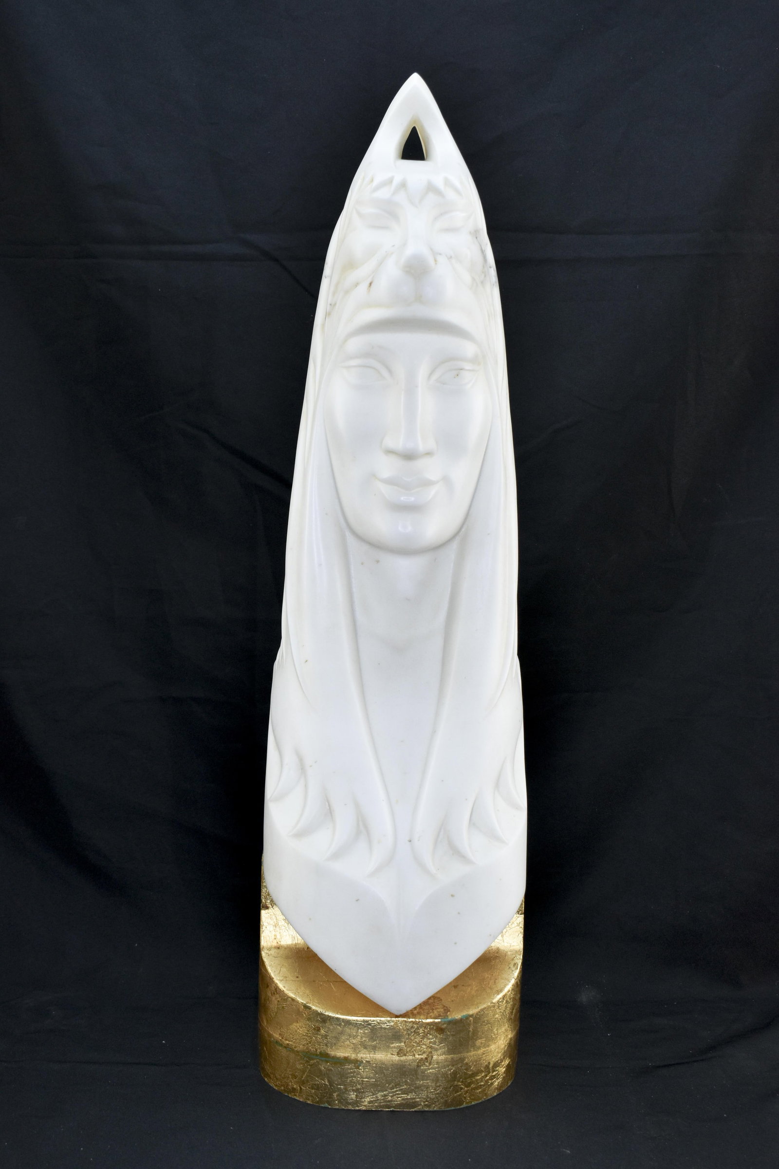 James Larson Marble Bust Sculpture: Marble carving of figure with lion headdress, signed James T. Larson and dated on the back, bottom center. Solid stone sculpture on solid wood base with gilt finish. Sculpture with base weighs 75 poun