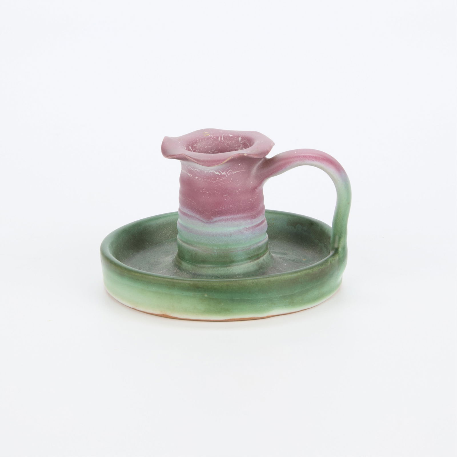 Vtg Weller Pottery "Fleron" Candlestick w/ Handle: Vintage Weller Pottery ceramic "Fleron" line candlestick holder with applied loop handle. Glazed matte green along the tray and magenta along the candlestick cup. With undulating rim and rib