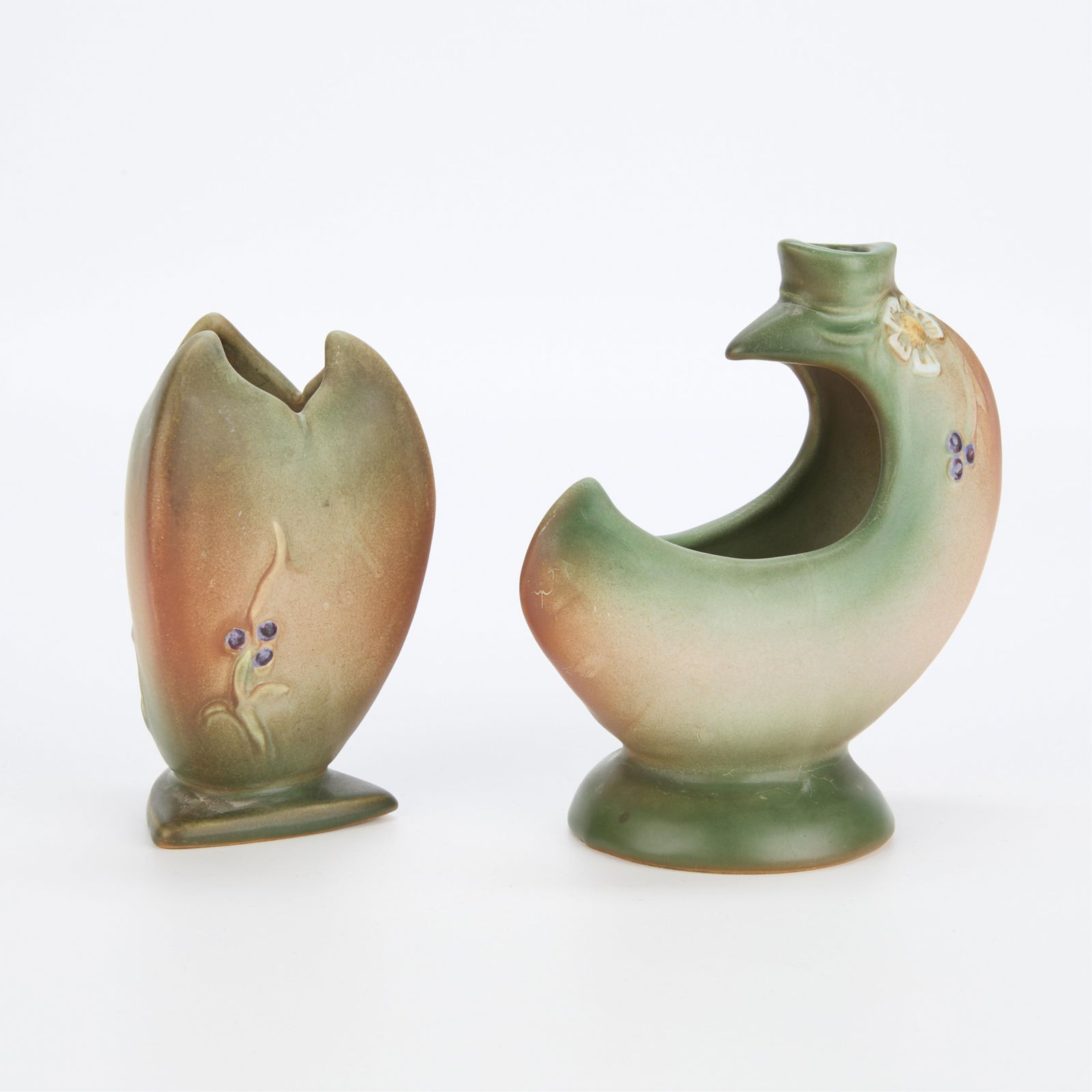 2 Vintage Weller Pottery "Tutone" Vases: Set of two Weller Art Potter "Tutone" patterned vases, ca. 1920s. Including a three-pointed cabinet vase with triangular footrim and an unusual crescent-form basket vase. Both with modest fl