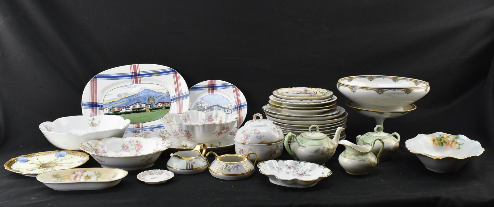 Large Group European Porcelain, Mostly French Limoges: Collection of european porcelain dishware including plates, bowls, and serving pieces. Most are French made, with a few German, Japanese, and other pieces.