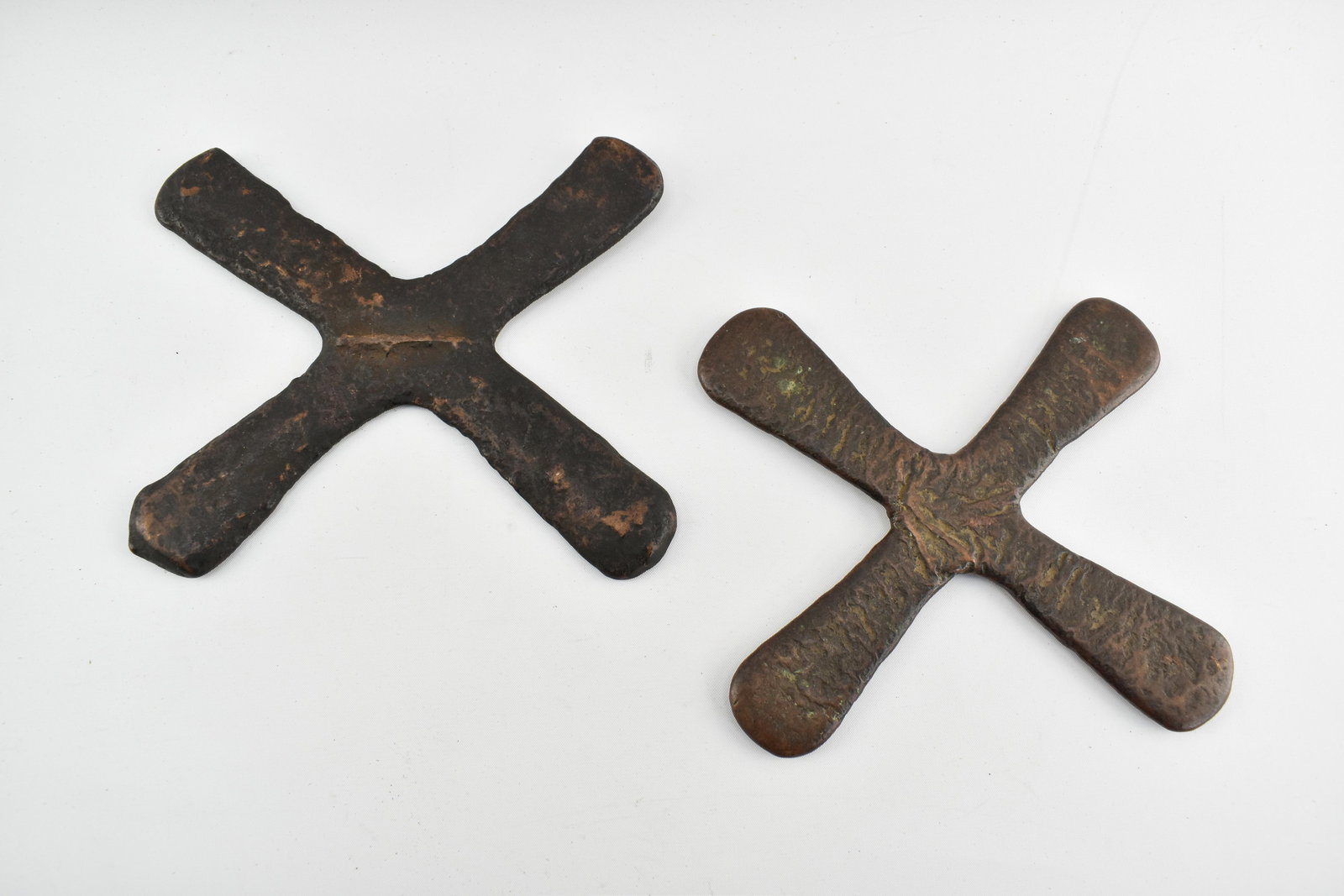 2 Copper Katanga Currency Crosses: 2 copper or similar metal Katanga currency crosses.One cross is 9"L on the diagonal and the other is 9.5"L on the diagonal.