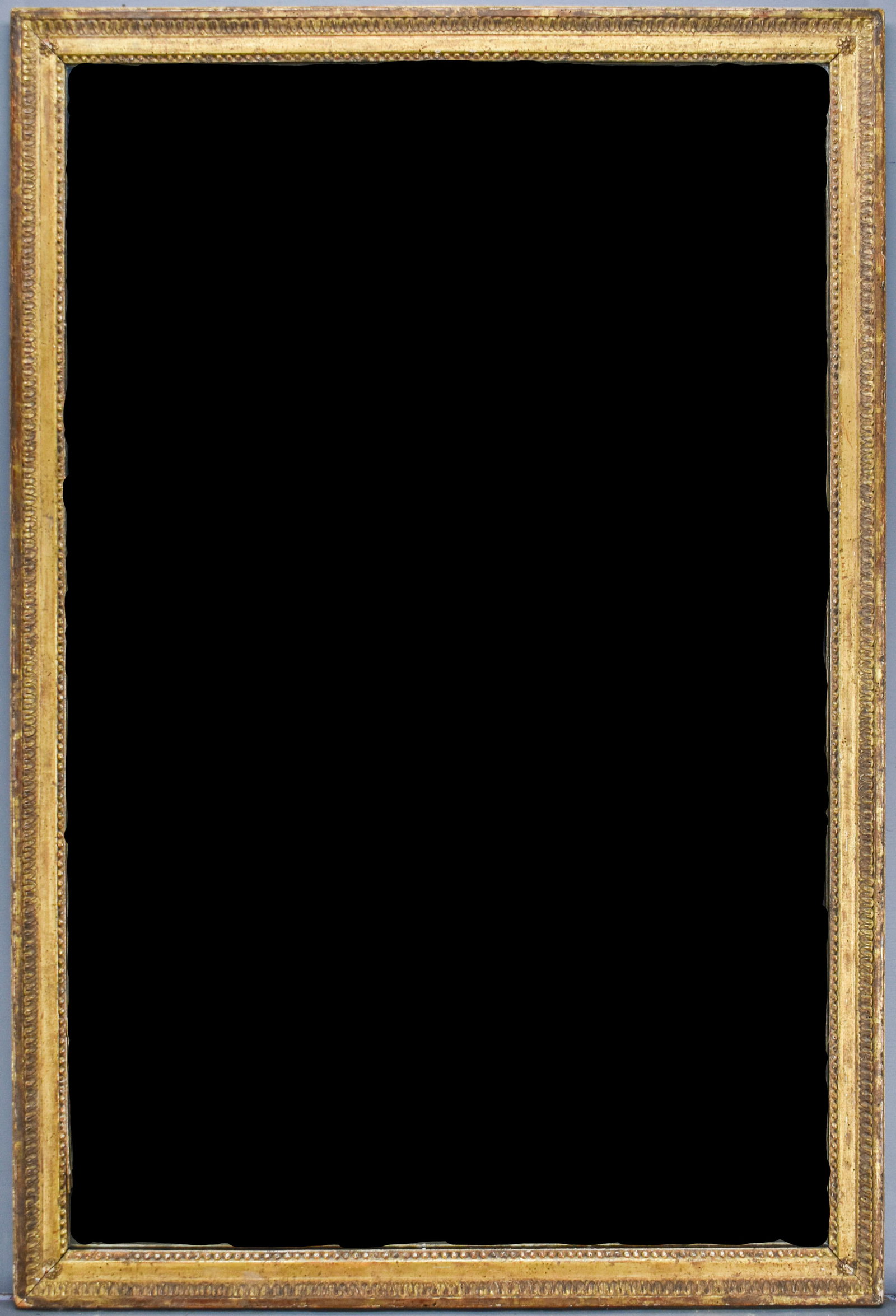 Large Antique Gilt Framed Mirror: Large antique mirror with gilt wood frame. Hardware on back allows piece to be hung vertically or horizontally.Note: Item is large and heavy.58" x 39"