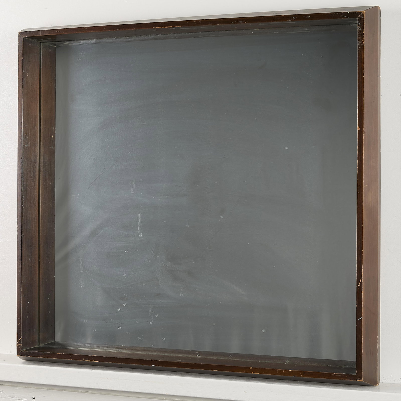 Vintage Mirror in Dark Brown Wooden Frame: Vintage rectangular mirror in dark wooden frame. Heavy, dark brown frame with beveled edge. 28 1/2"H x 29 3/4"W x 3 1/2"D.