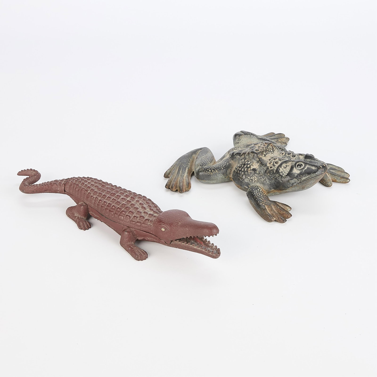 Vintage Cast Iron Frog & Alligator Figures: Vintage or antqiue castiron animal figures. Includes brick red painted alligator with lid that hinges open and comes off. Also includes frog doorstop/figure. Both items appear unmarked. Frog:2"H 