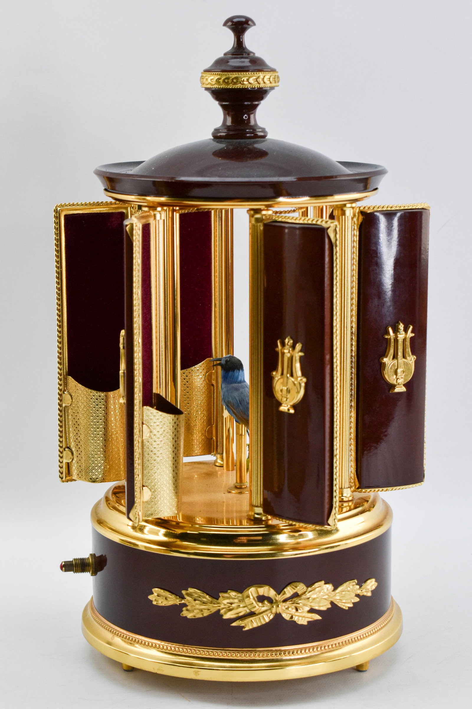 Swiss Reuge Bird Automaton Cigar Music Box: Swiss music box by Reuge Music with storage for 6 cigars, lipstick, or whatever you want! When the music box is wound and the button pressed, 6 panels open to reveal cigar storage as a blue songbird t