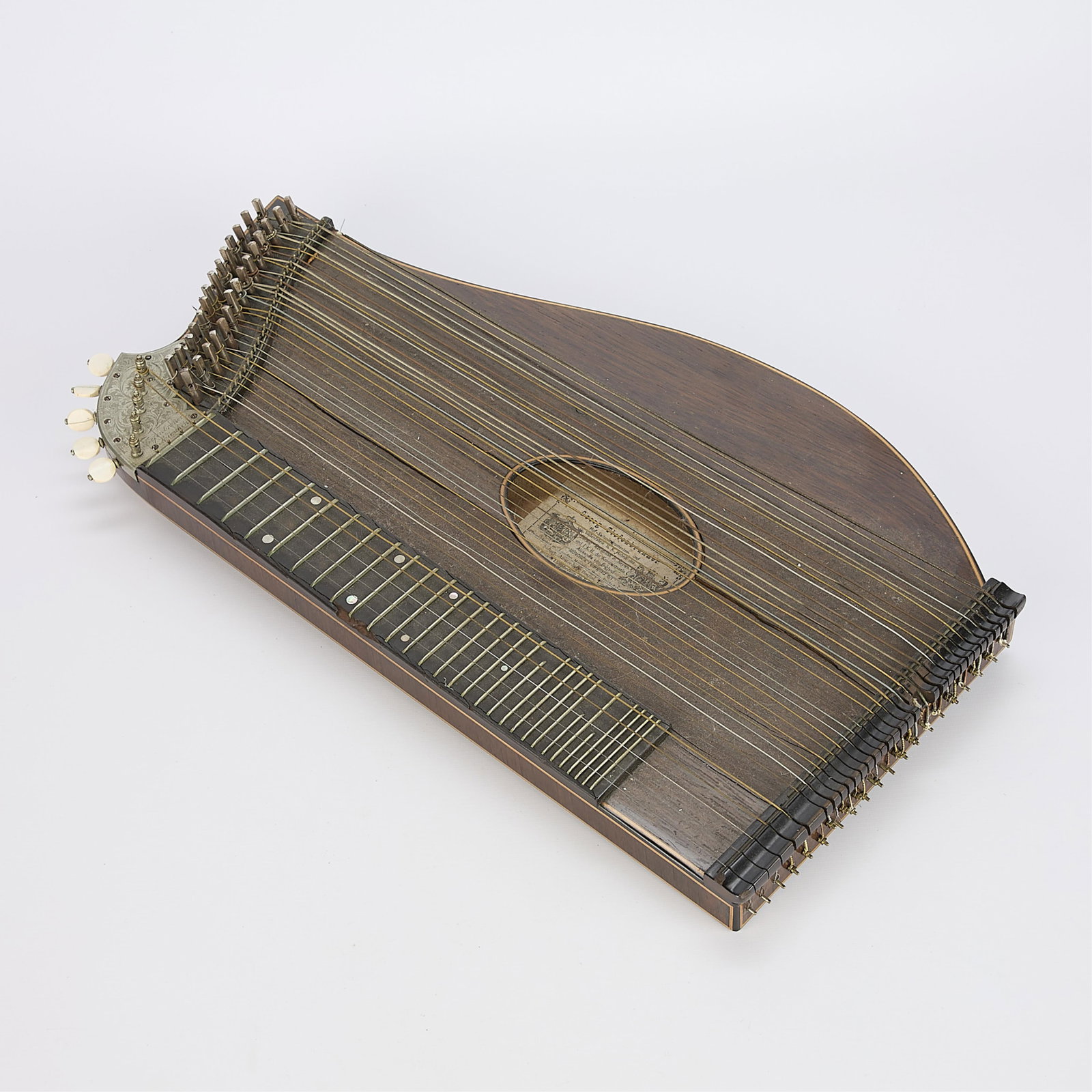 Vintage 19th c. 32-String Austrian Zither: Vintage 19th century 32-string Austrian or European zither instrument. Label along the interior reading "George Tiefenbrunner."22"H x 12"W x 1.5"D