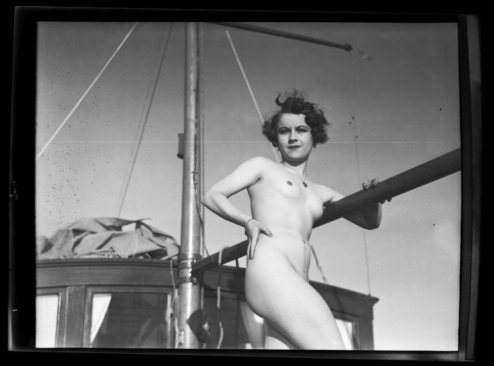 Vintage 1920s Edwin Bower Hesser 4" x 5" Negative Nude Yachting: This is a vintage 1920s black and white negative taken by photographer Edwin Bower Hesser of a beautiful nude flapper getting ready to set sail on her yacht. Hesser was one of the few portraitist who