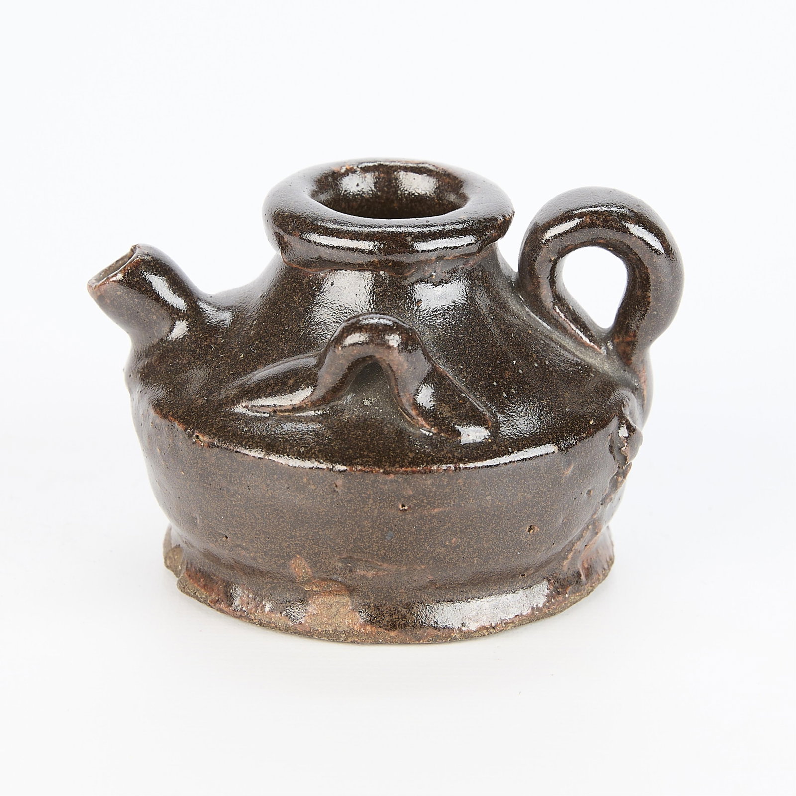 Early Chinese Ceramic Water Dropper: Early Chinese ceramic dark brown glazed water dropper vessel. With three applied loop handles and a spout stemming from the shoulder. 2.5"H x 3.5"W x 3"D