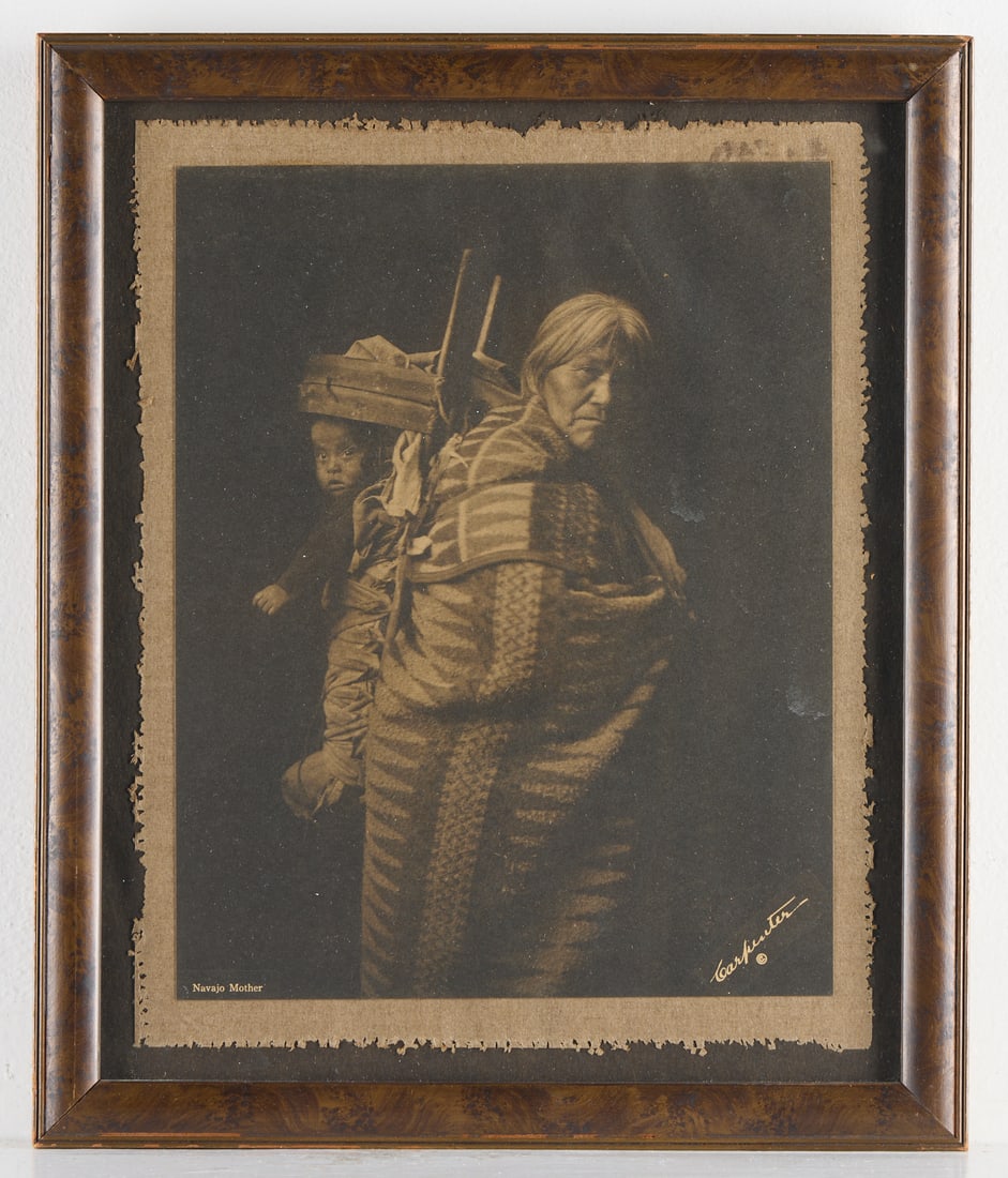 Carpenter "Navajo Mother" Collotype Photo Print: Charles Carpenter (American, 19th/20th century. Collotype photographic print titled "Navajo Mother," ca. 1910. Double mounted, with titled and signature in negative along the lower edge.Prov