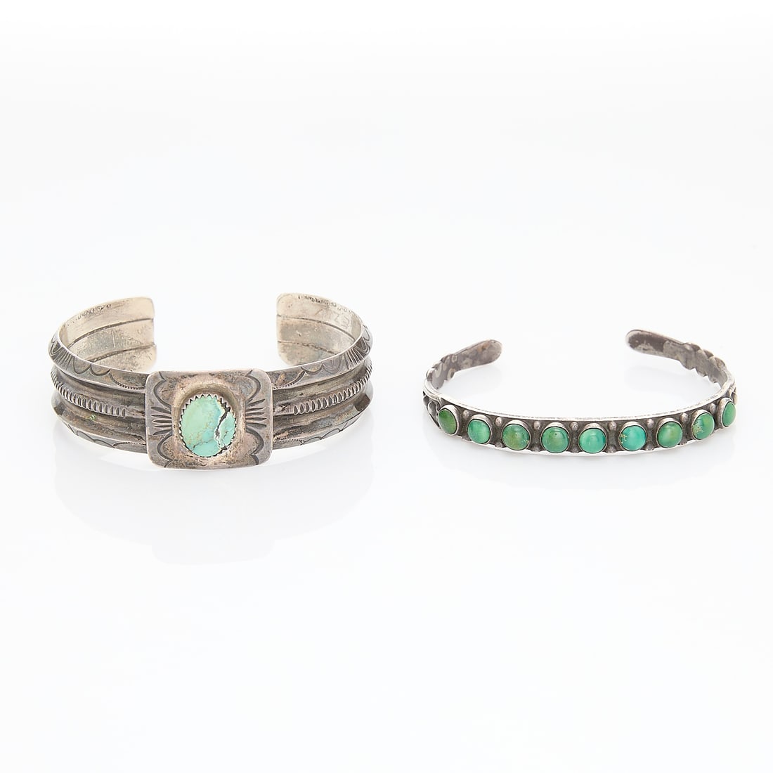 Two Turquoise Bracelets: Two turquoise cuff bracelets, one marked sterling one unmarked.Gross weight: Approximately 58g