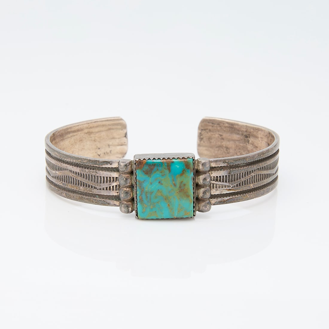 Jimmy Yazzie Sterling & Turquoise Cuff Bracelet: Cuff bracelet set with square turquoise marked "Sterling" and with initials JY.Gross weight: Approximately 32g