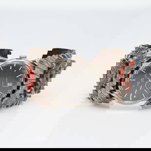 Sterling Silver & Coral Navajo Watch Cuff by Lambert Livingston: Sterling silver watch cuff with elaborate designs in relief and set with coral. Marked "sterling," "LL," and "USA". Set with Kenneth Cole watch.Gross weight: Approximatel