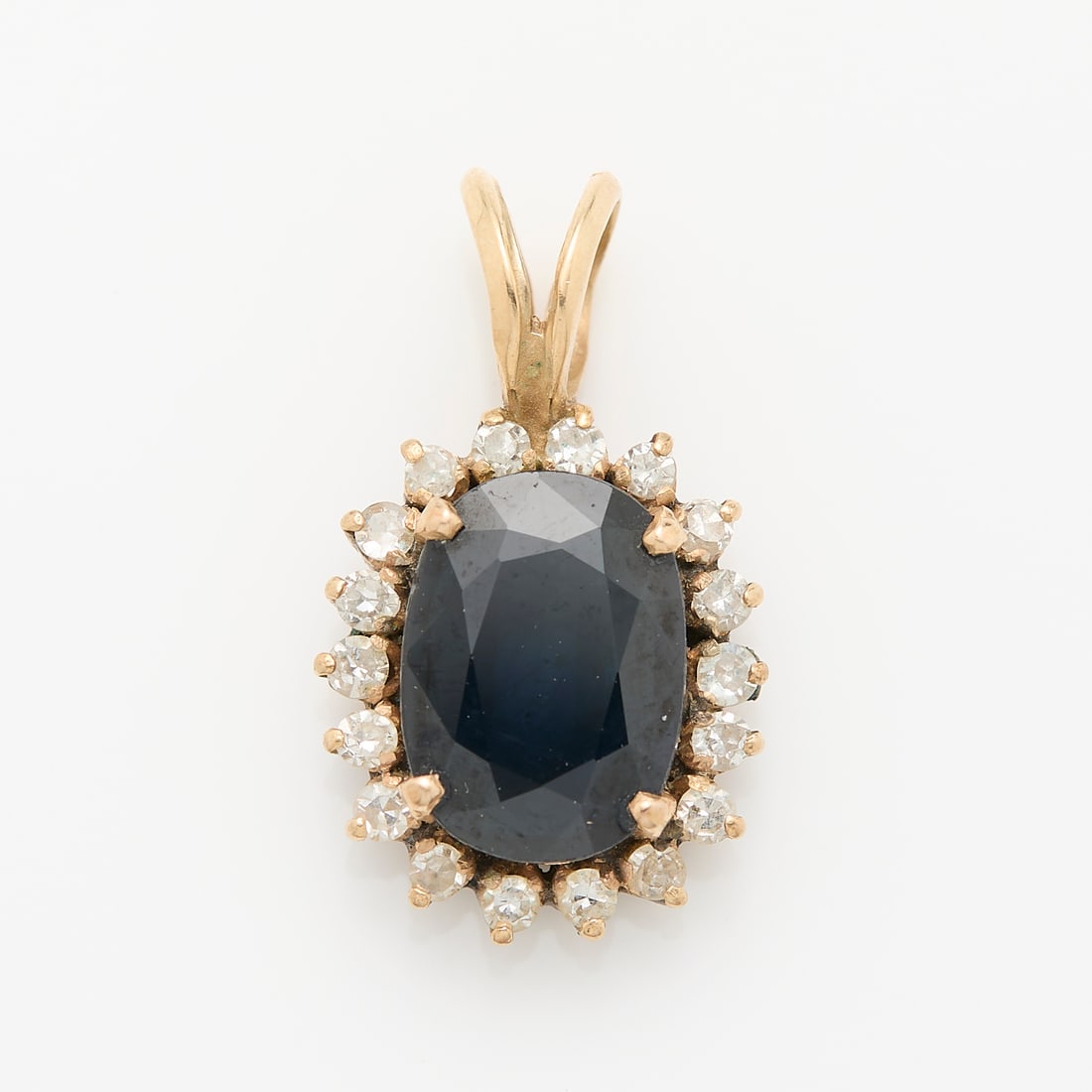 Unmarked Diamond & Sapphire Yellow Gold Pendant, Likely 14K: Unmarked yellow gold pendant set with diamond halo and sapphire center stone. Appears unmarked. .75"H x .5"W