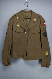 WWII Era U.S. Army Wool Field Jacket: WWII Era U.S. Army wool field jacket, Corporal rank with unit insignia. Comes in a denim garment bag.