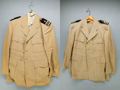 2 U.S. Navy Khaki Uniforms with Oak Leaf Shoulder Board Insignia: U.S. Navy khaki uniforms with Oak Leaf shoulder board insignia. Includes two jackets, two trousers, one shirt. Comes in a denim garment bag.